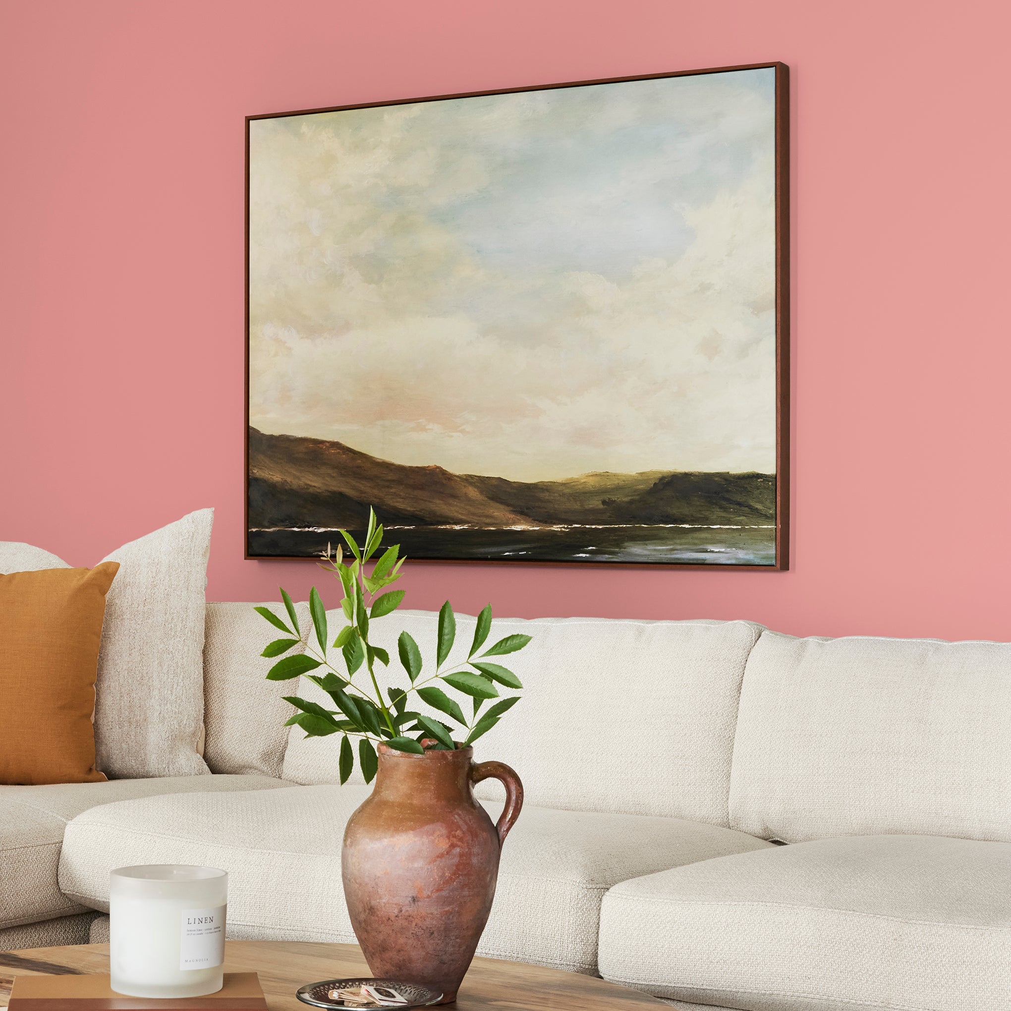 Coral pink interior paint named pink lemonade shown painted on living room wall