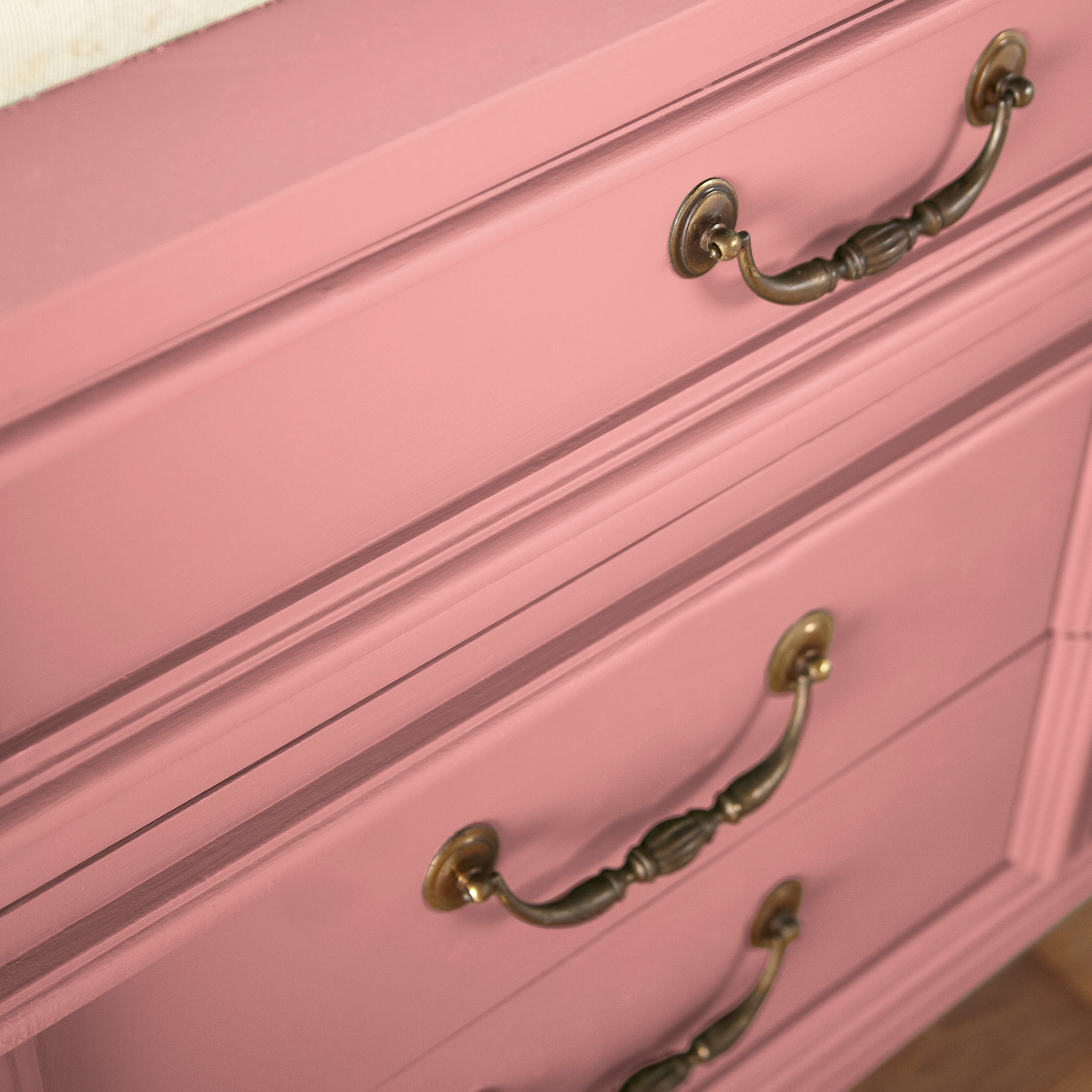 a coral pink trim, door and cabinetry paint named pink lemonade shown painted on cabinet