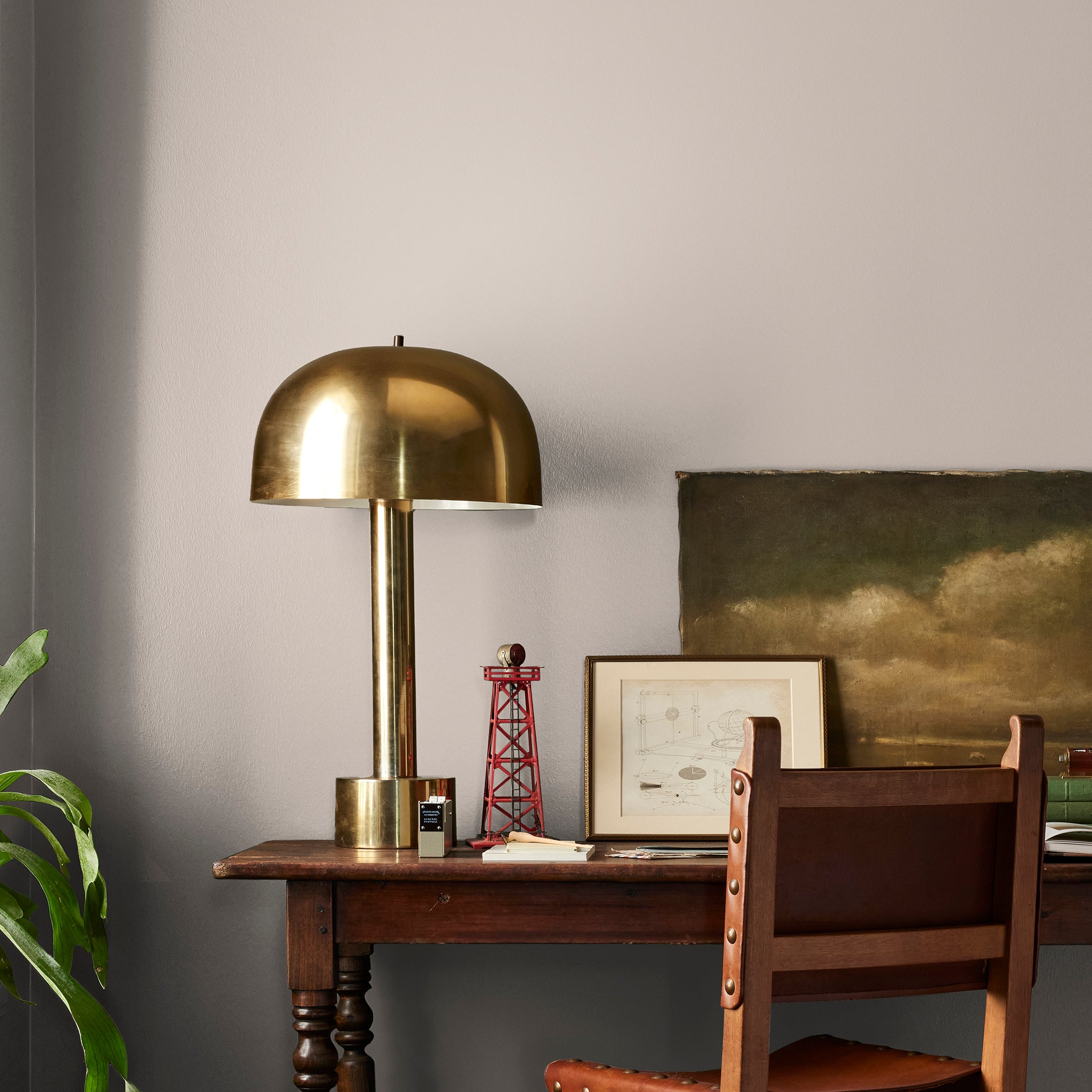 Sandy tan with pink notes interior paint named cinnamon sugar shown painted on bedroom wall