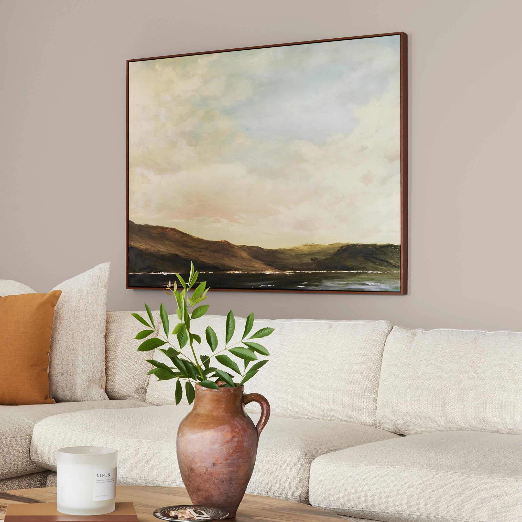 Sandy tan with pink notes interior paint named cinnamon sugar shown painted on living room wall