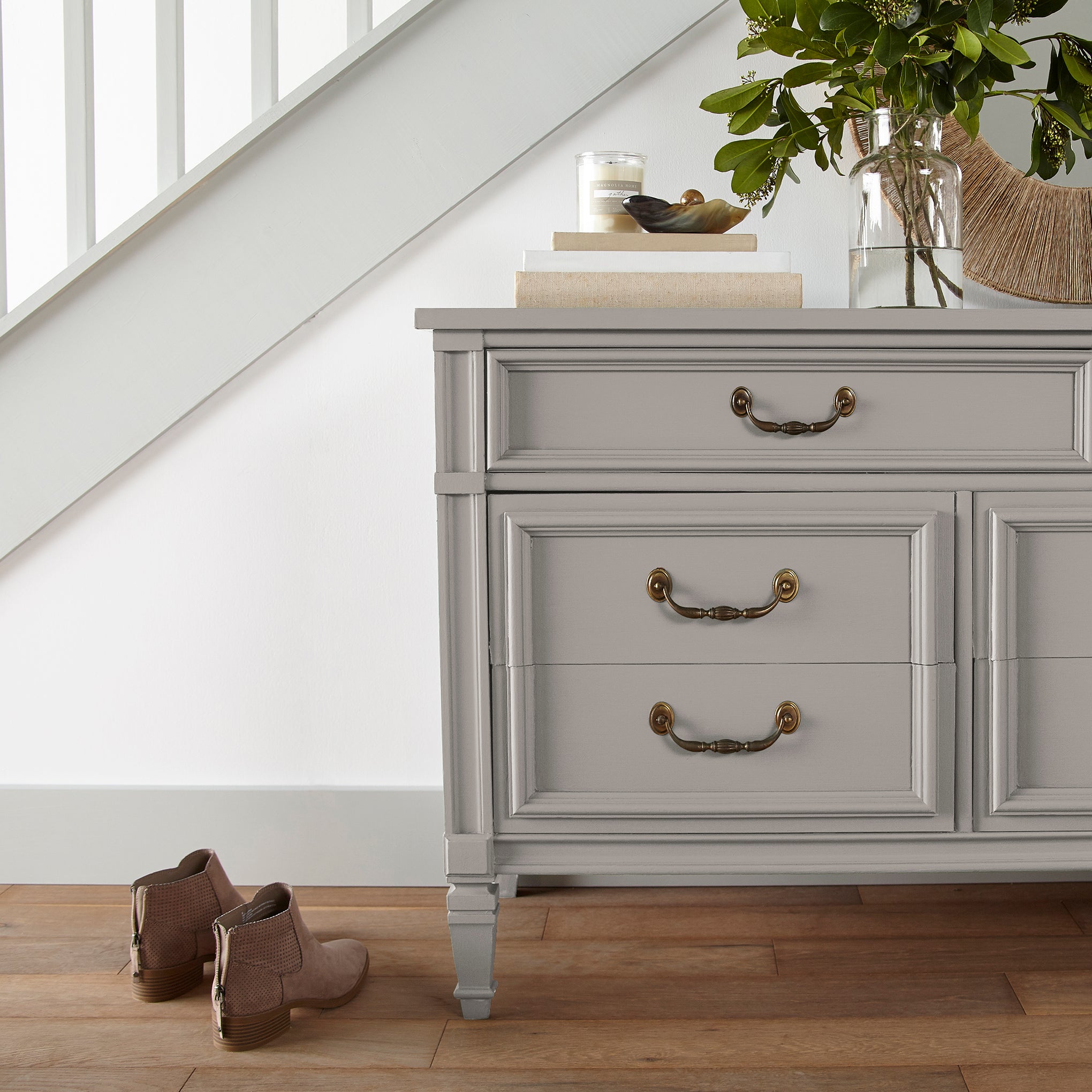 A mid-toned taupe door and cabinet paint named timeless look shown painted on entryway cabinet