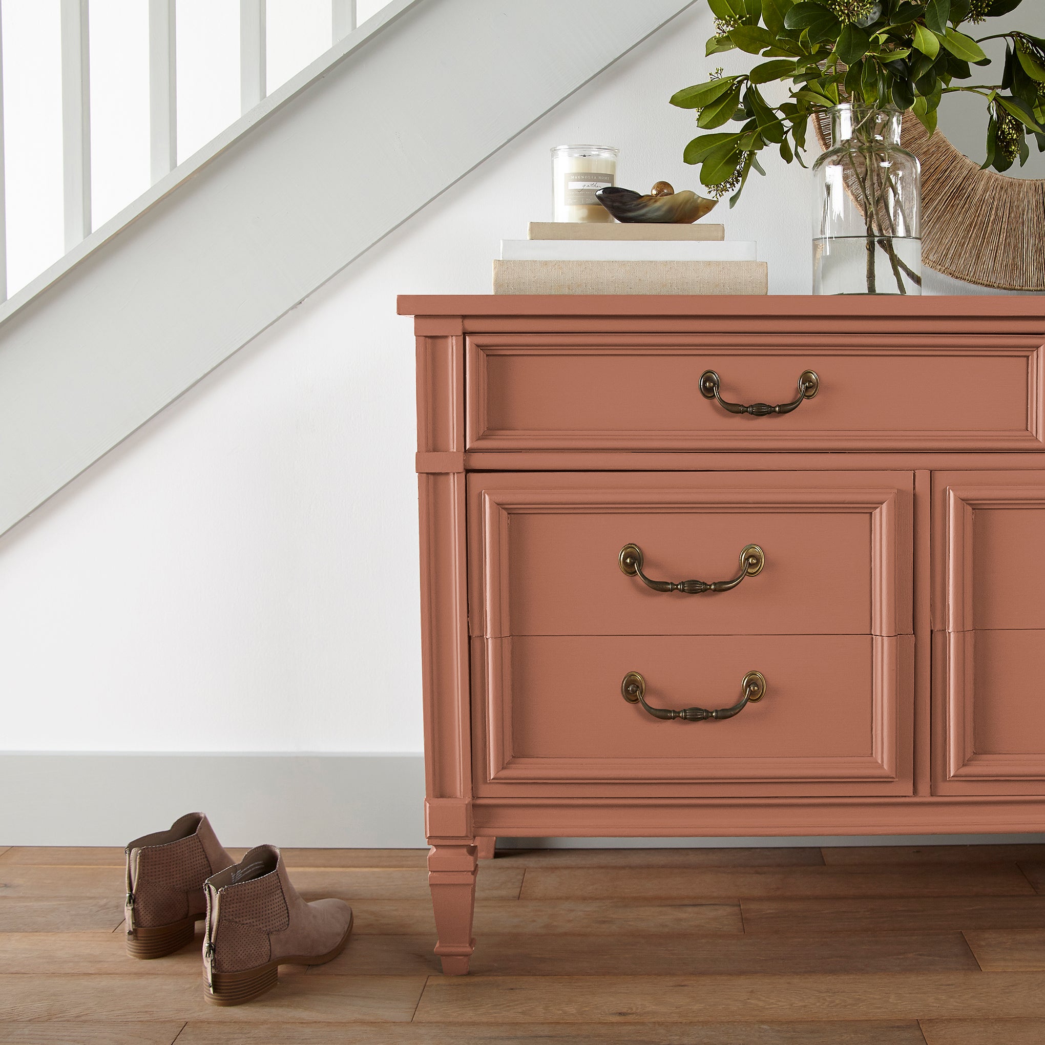 muted burnt orange door and cabinet paint named work worn wood shown painted on entryway cabinet