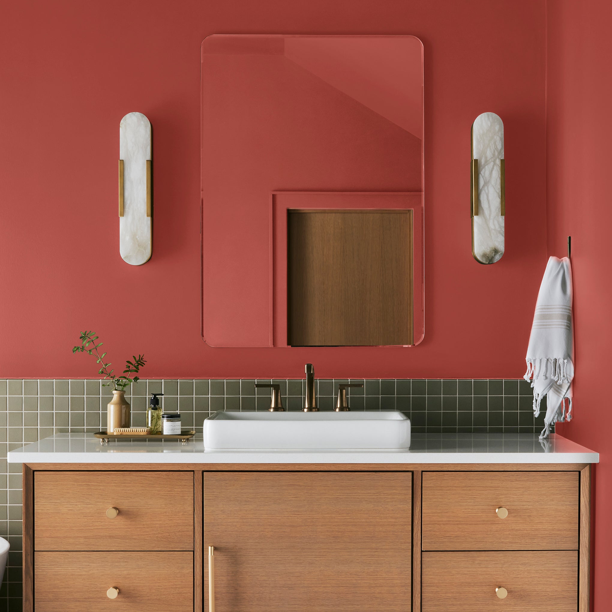 Bright red interior paint named hopscotch shown painted on bathroom wall