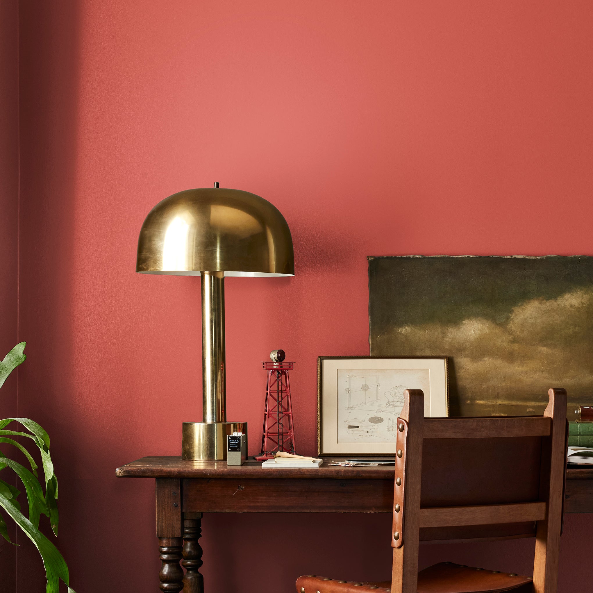 Bright red interior paint named hopscotch shown painted on bedroom wall