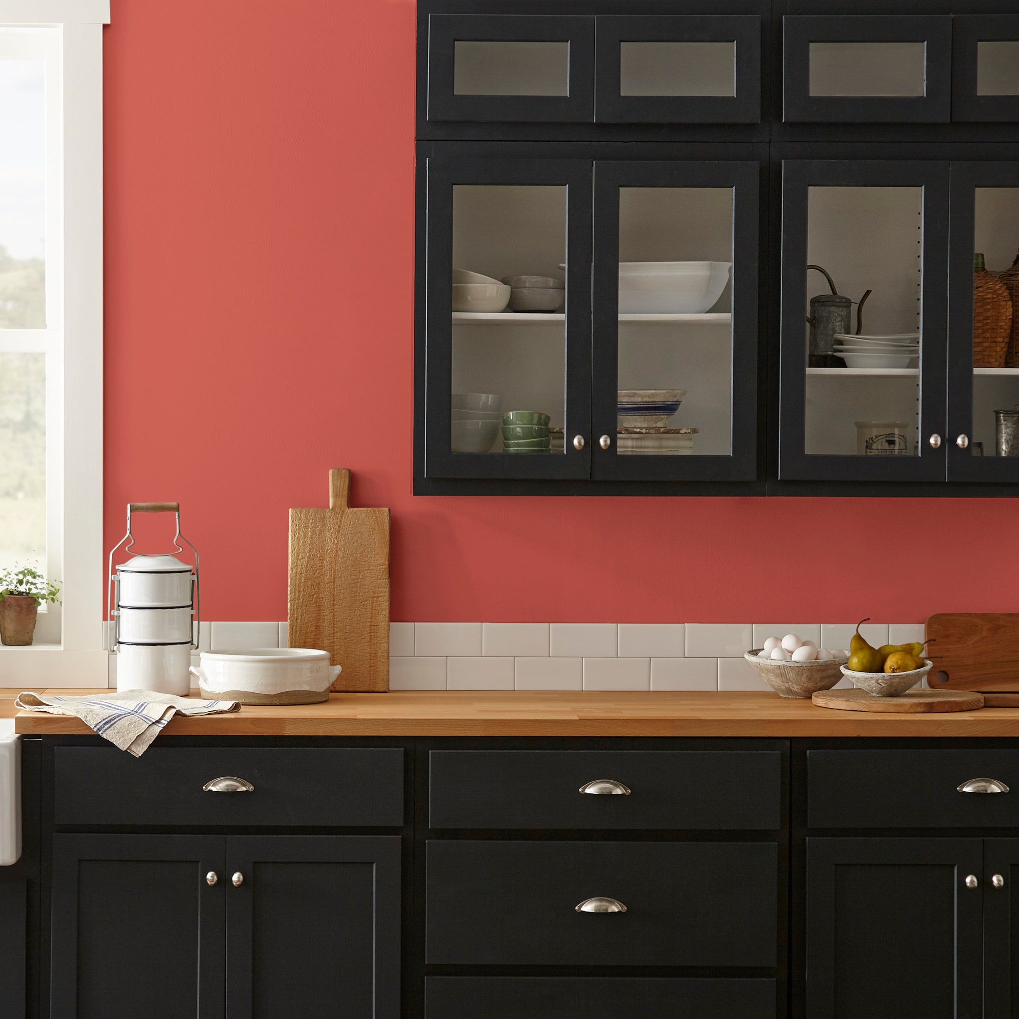Bright red interior paint named hopscotch shown painted on kitchen wall