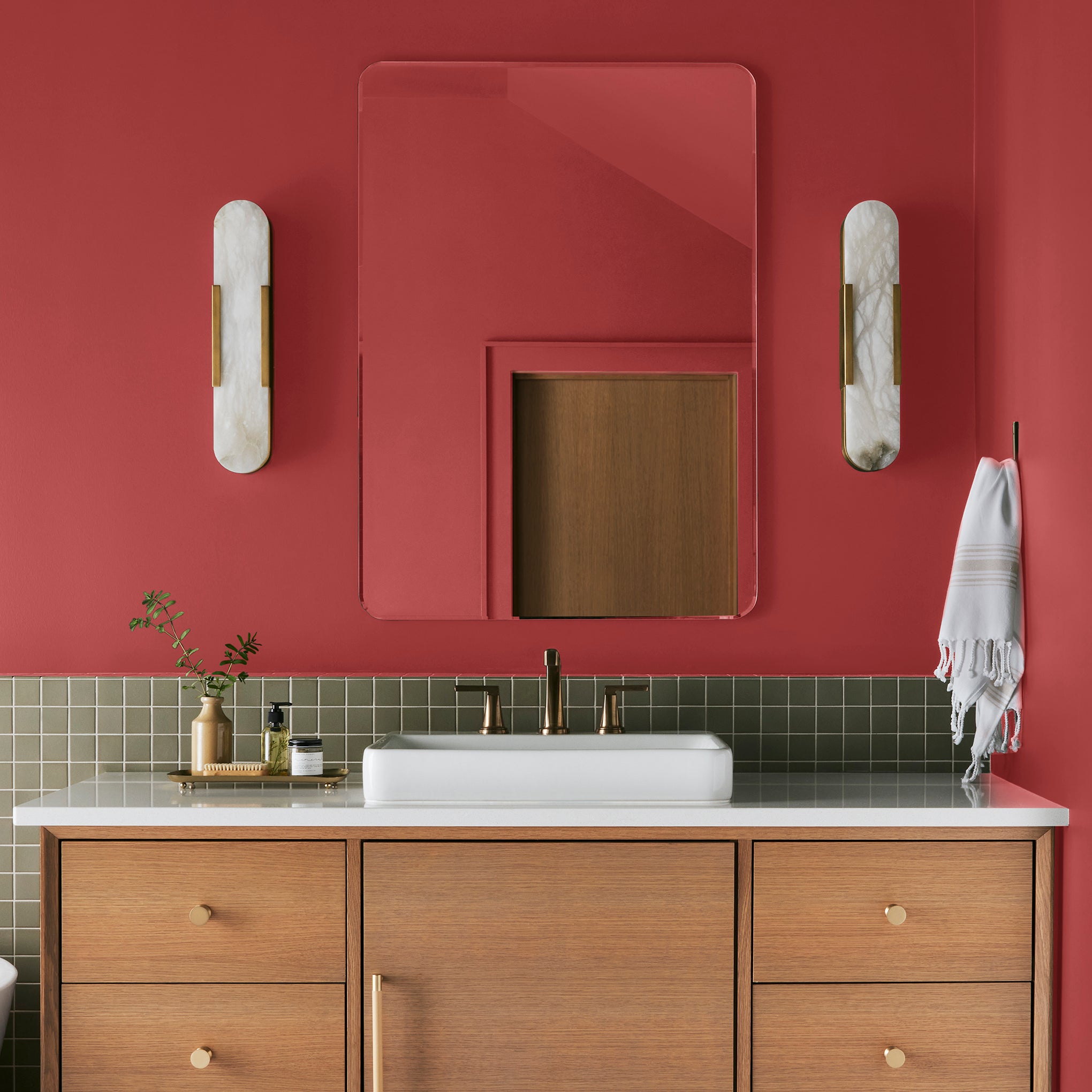 Bright pomegranate red interior paint named brave and bold shown painted on bathroom wall
