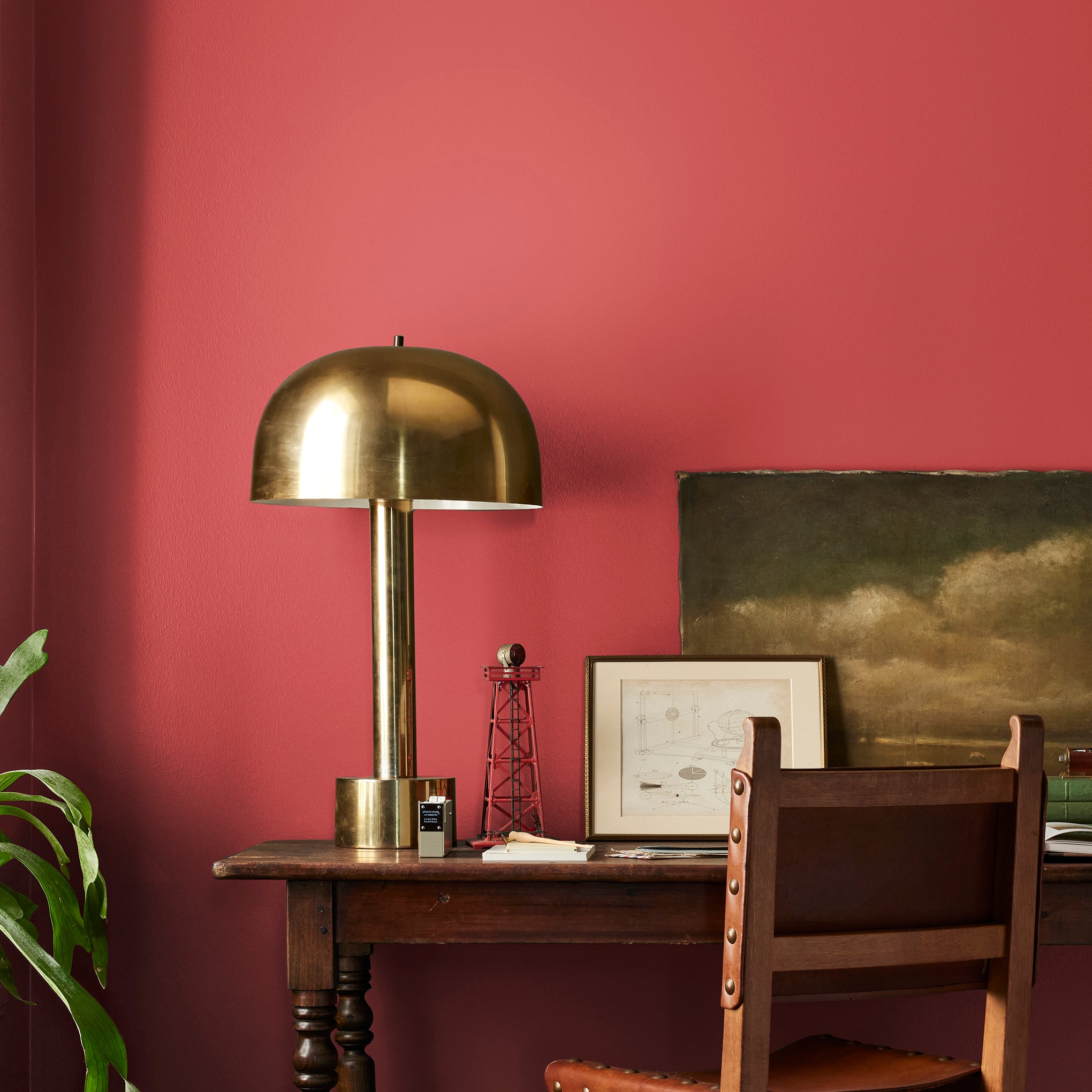Bright pomegranate red interior paint named brave and bold shown painted on bedroom wall