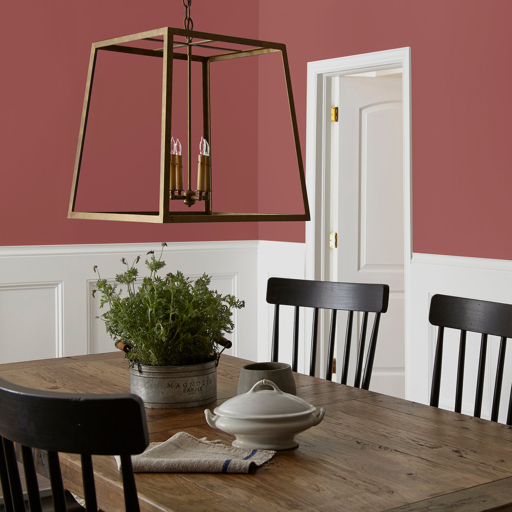 deep red paint named create shown painted on dining room wall