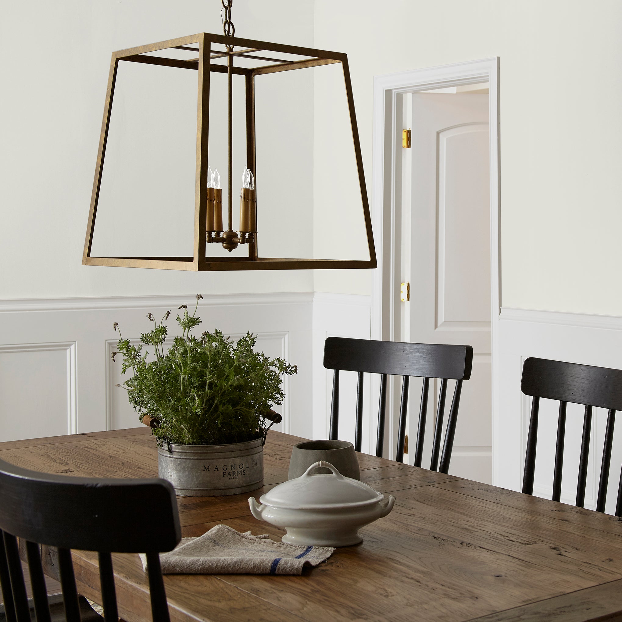 Crisp white with beige interior paint named panna cotta shown painted on dining room wall