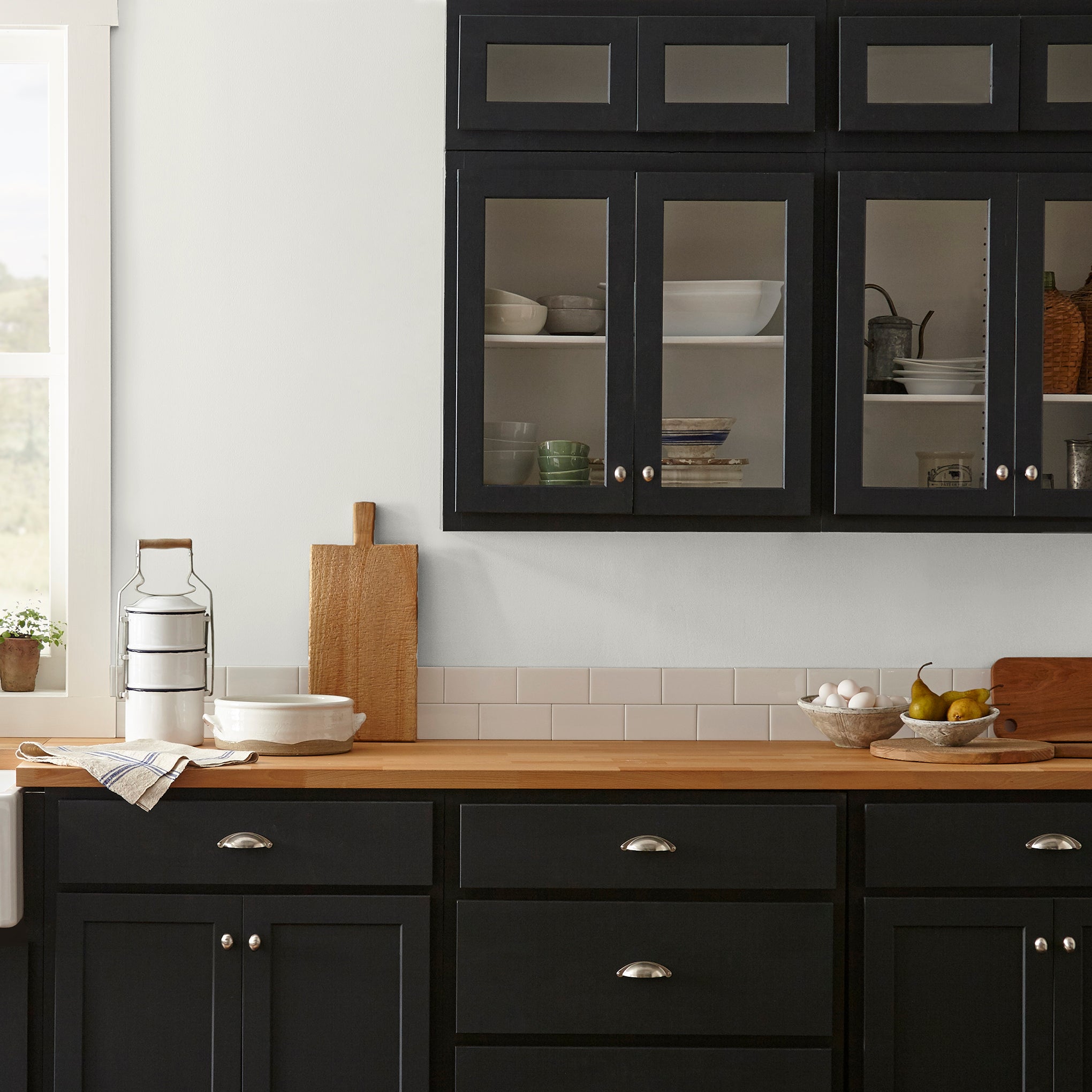 Crisp white with beige interior paint named panna cotta shown painted on kitchen wall
