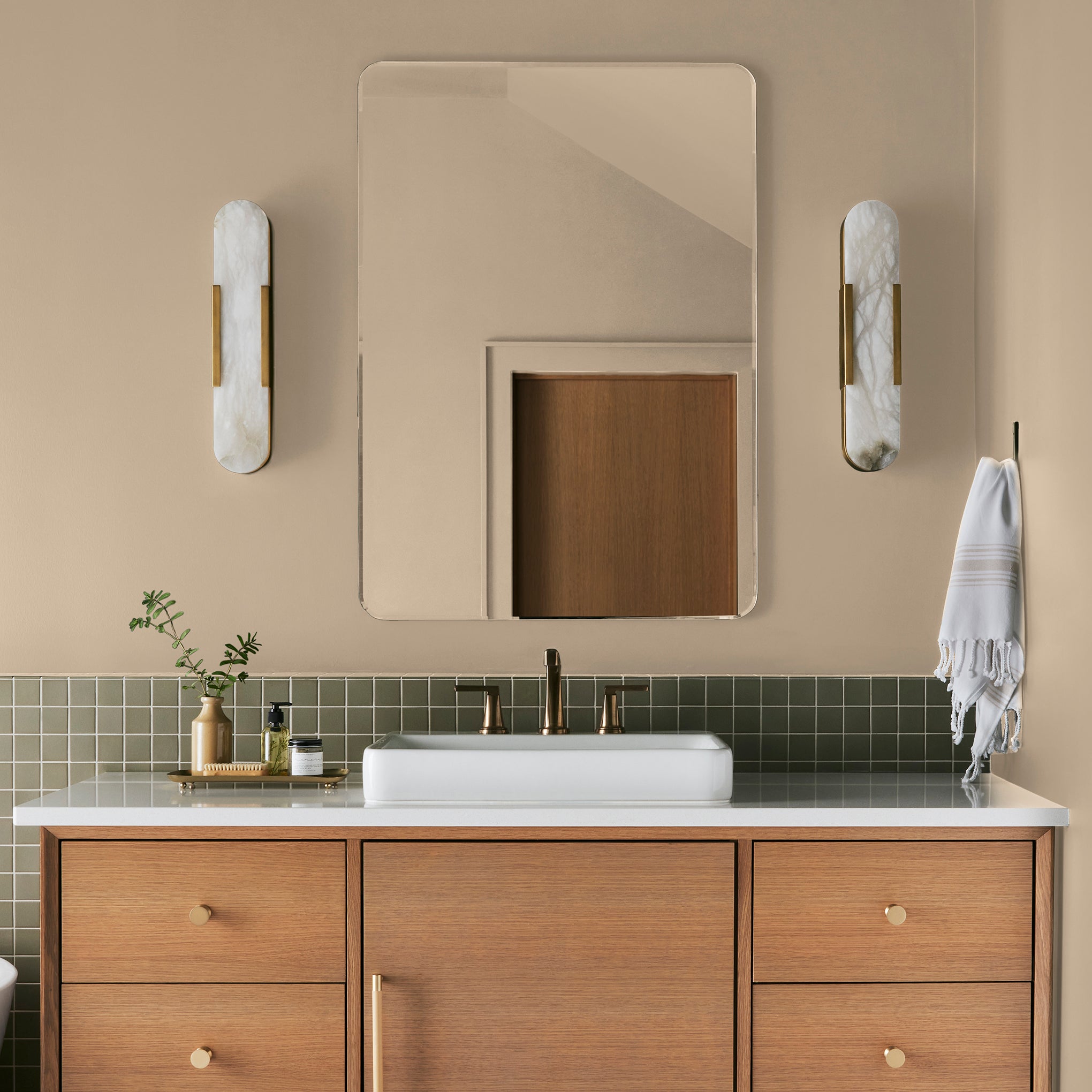 pastel yellow-beige paint named ambient light shown painted on bathroom wall