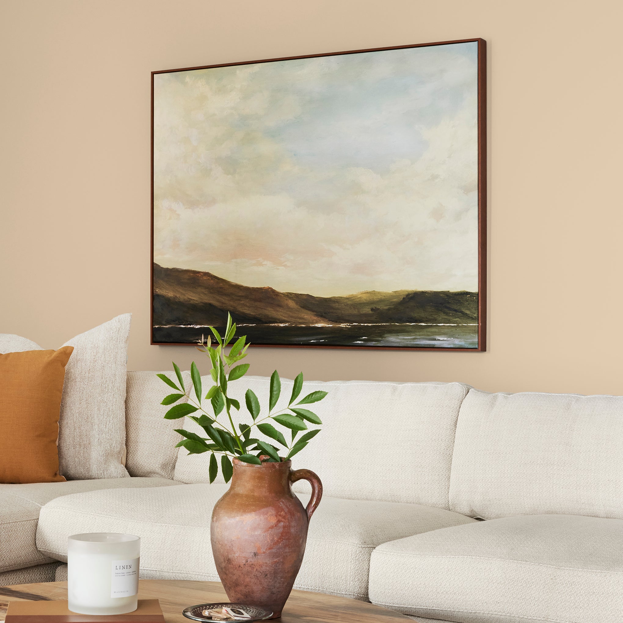 pastel yellow-beige paint named ambient light shown painted on living room wall