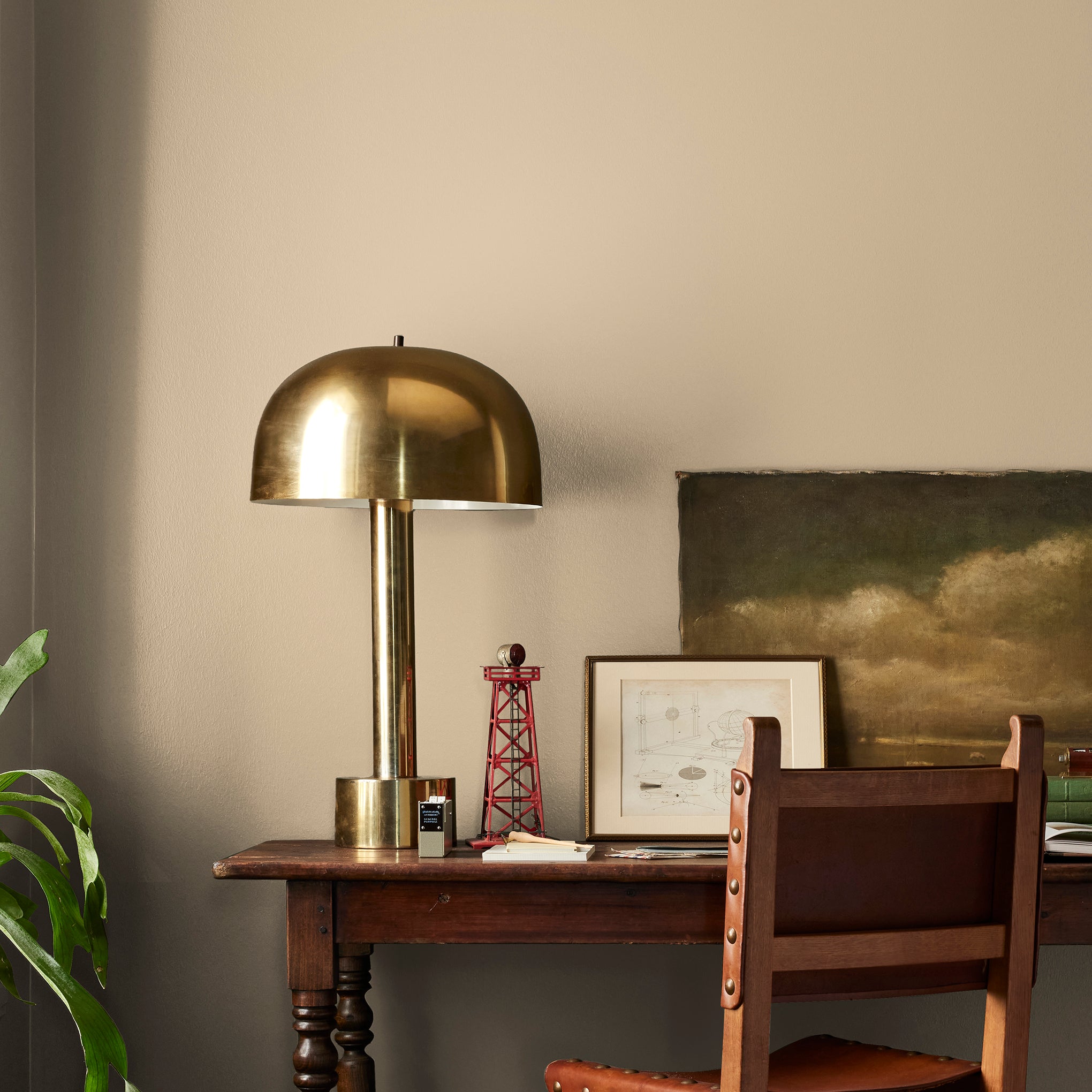 Light sandy gold interior paint named summer pear shown painted on bedroom wall