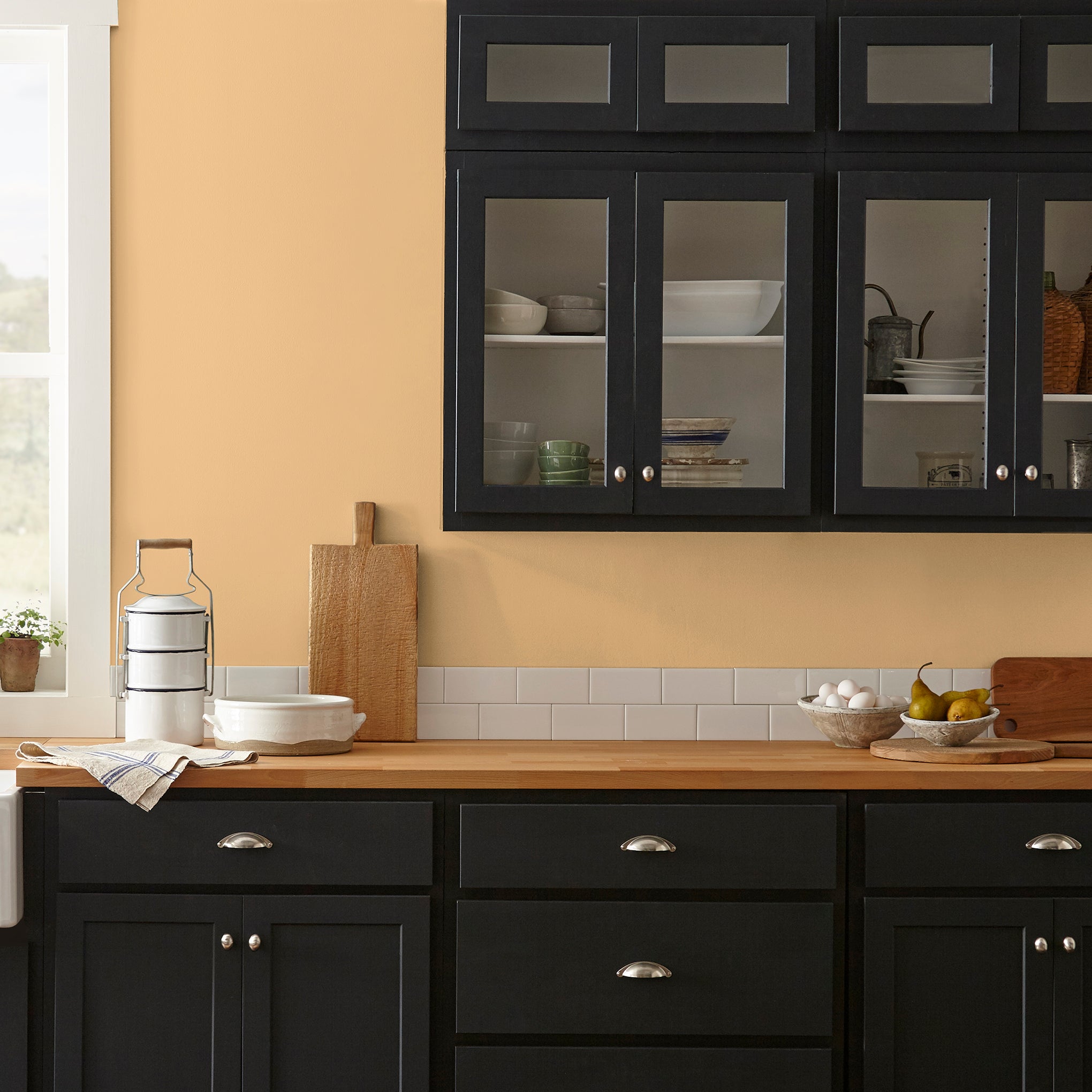 golden-yellow classic interior paint named amber shown painted on kitchen wall
