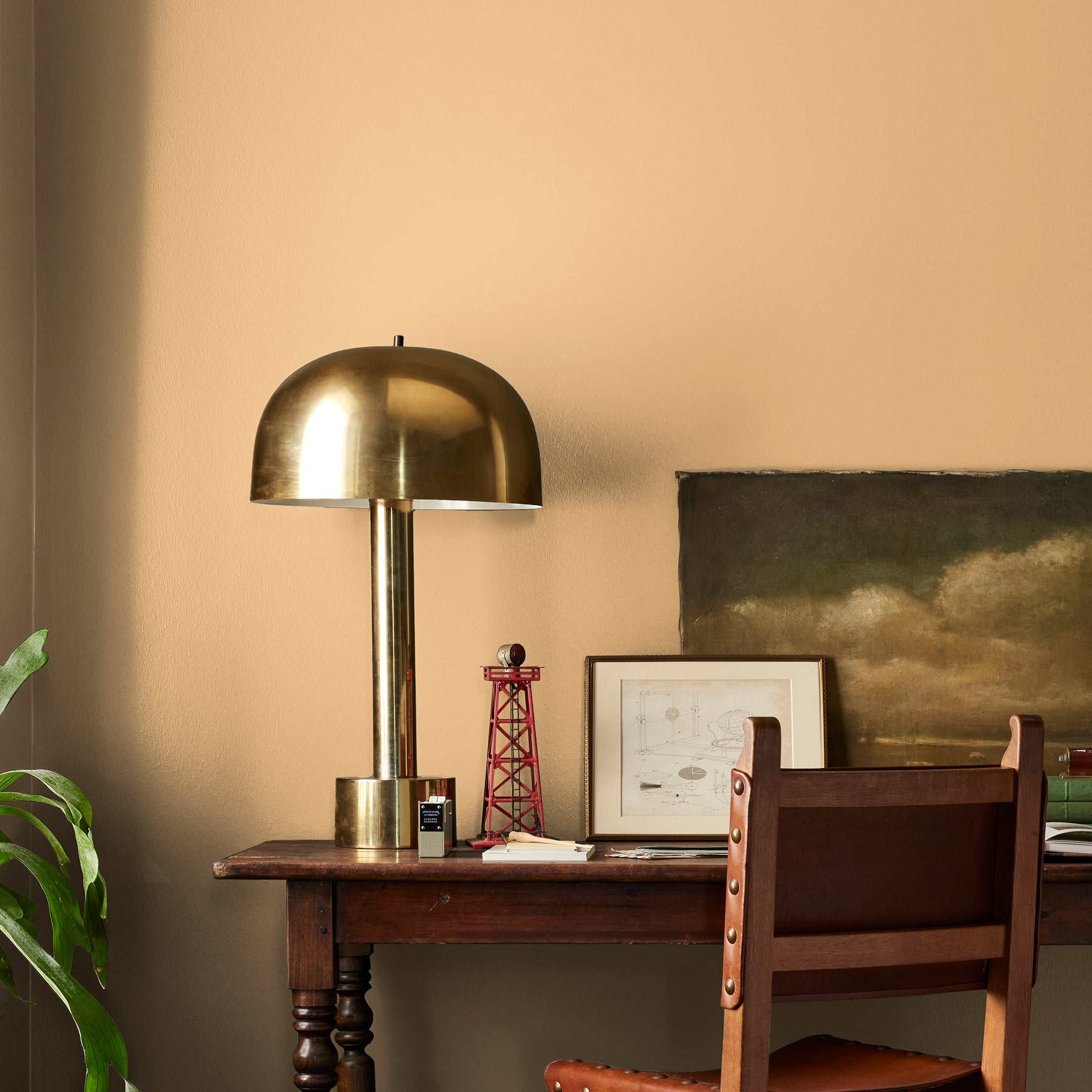 Muted mid-toned yellow interior paint named cottage feel shown painted on bedroom wall