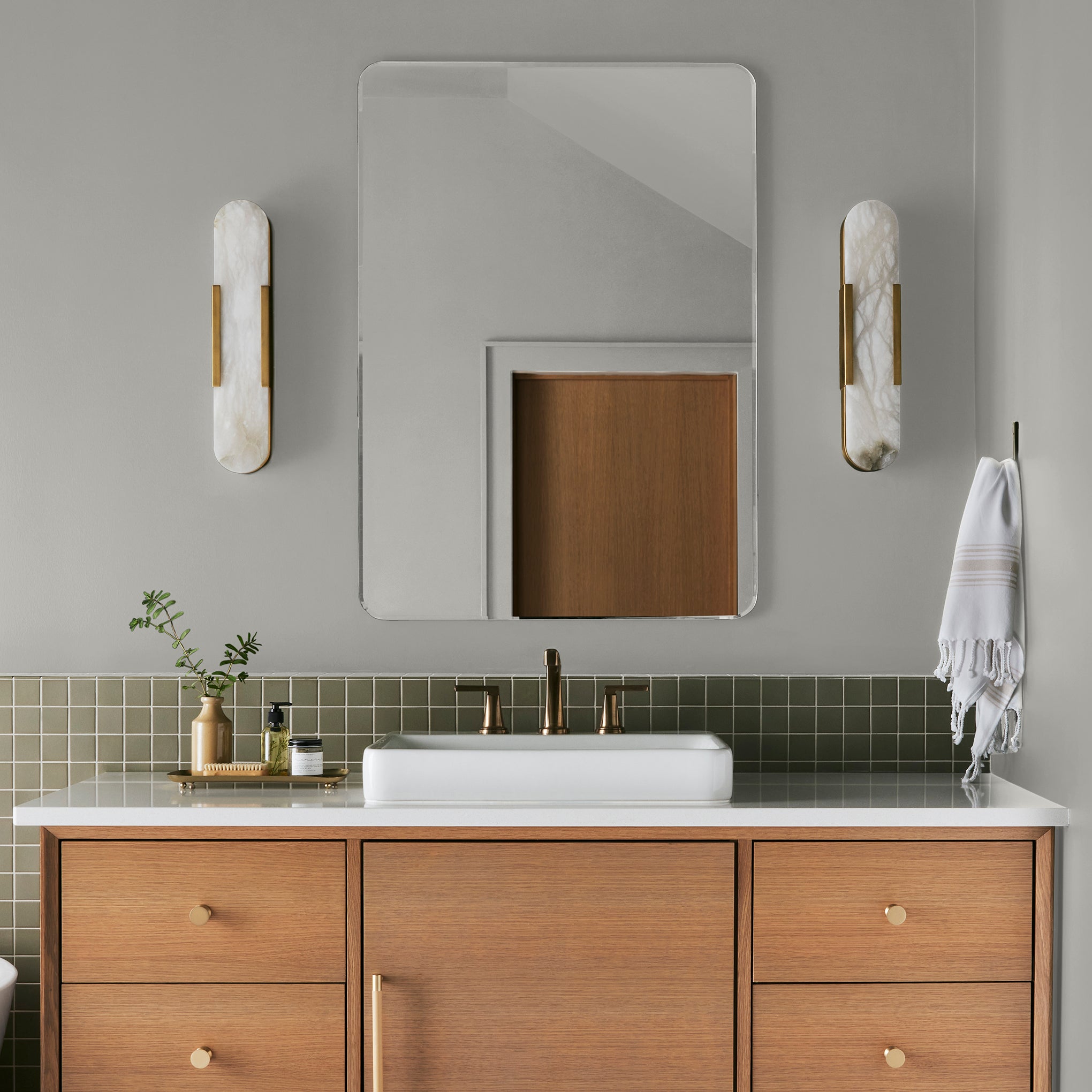 A light pale gray-green interior paint named earl gray shown painted on bathroom wall