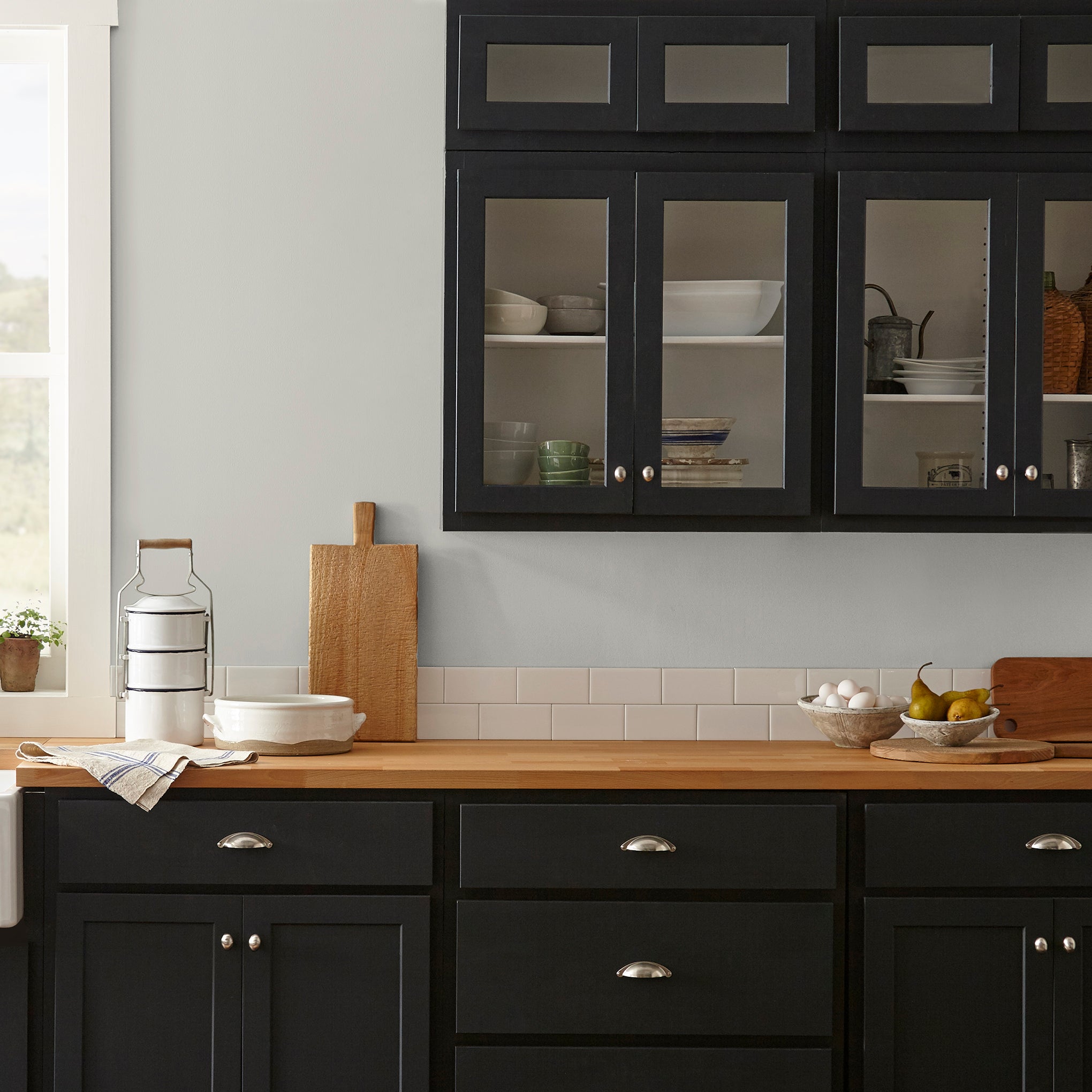 A light pale gray-green interior paint named earl gray shown painted on kitchen wall