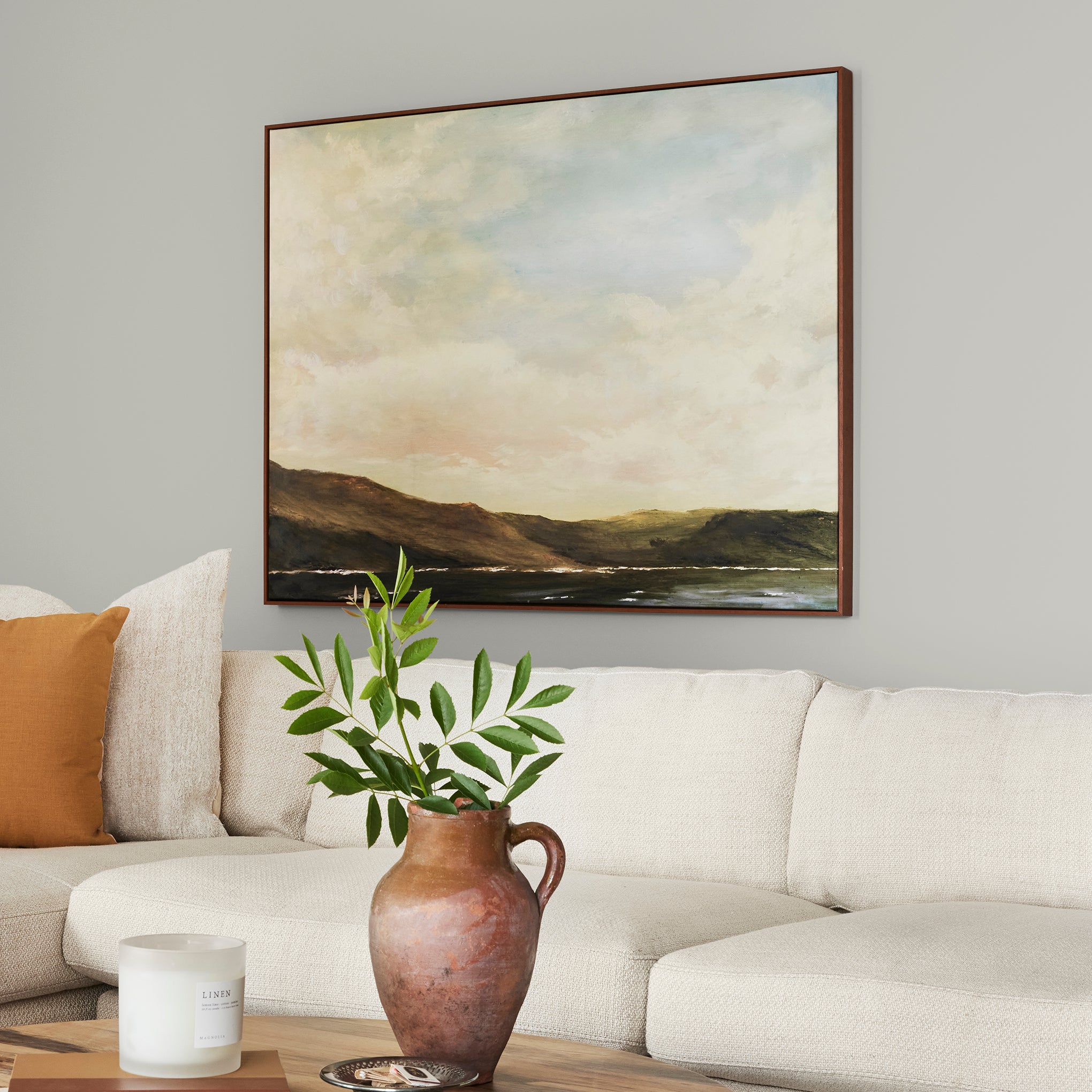 A light pale gray-green interior paint named earl gray shown painted on living room wall