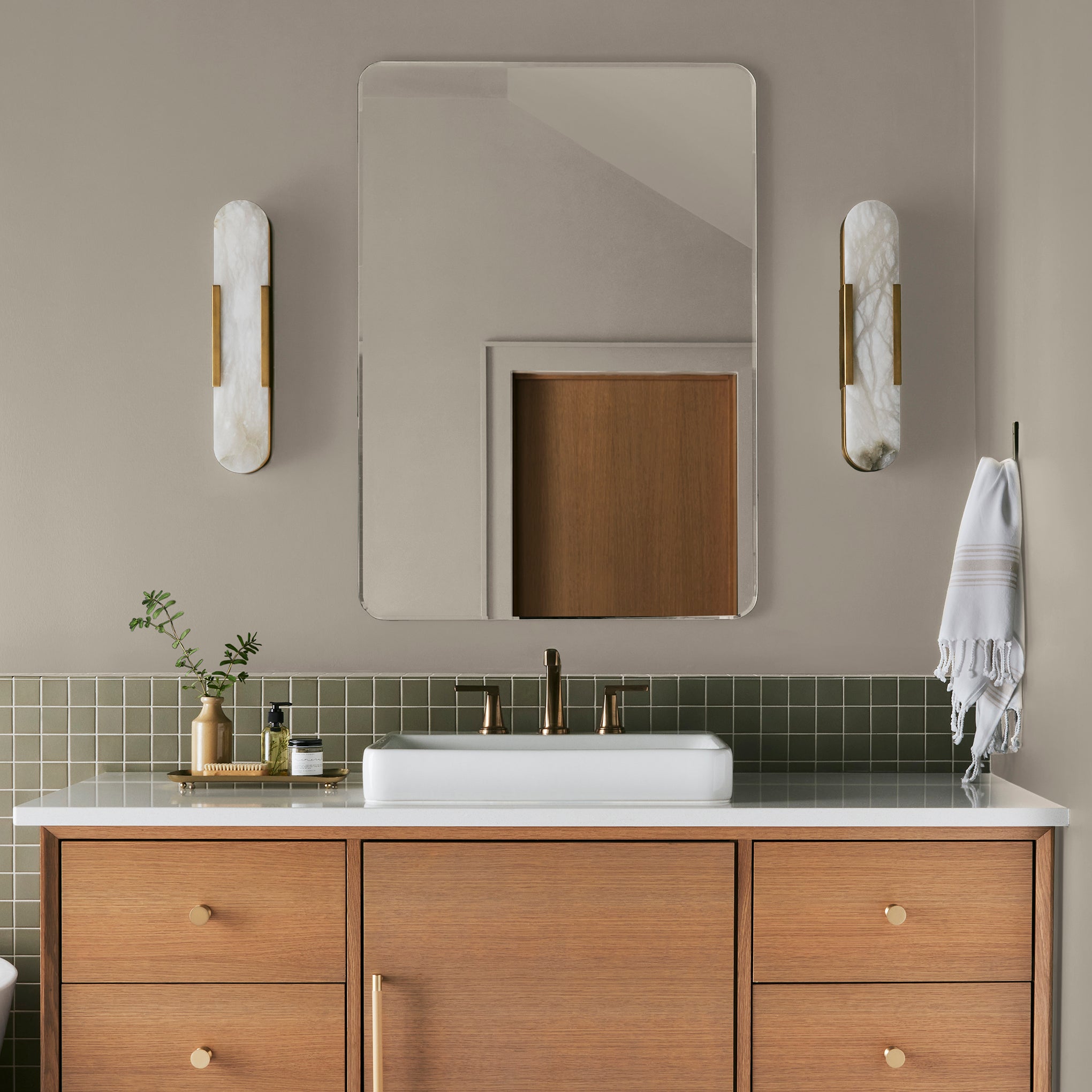 A khaki beige interior paint named solid wood shown painted on bathroom wall
