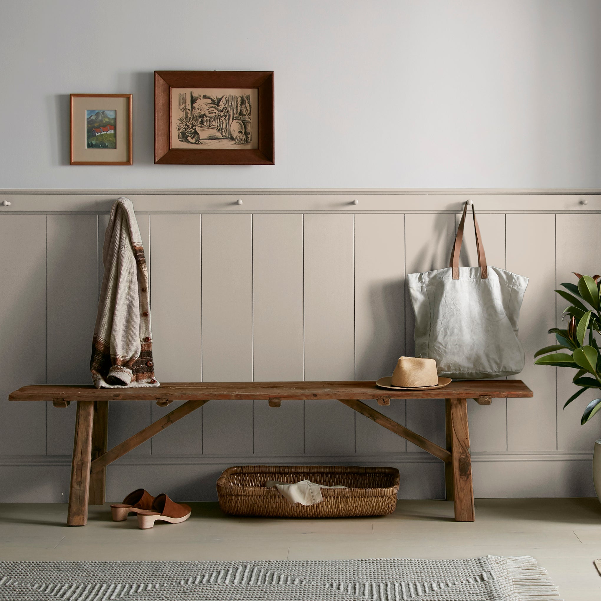 A khaki beige interior paint named solid wood shown painted on entryway wall