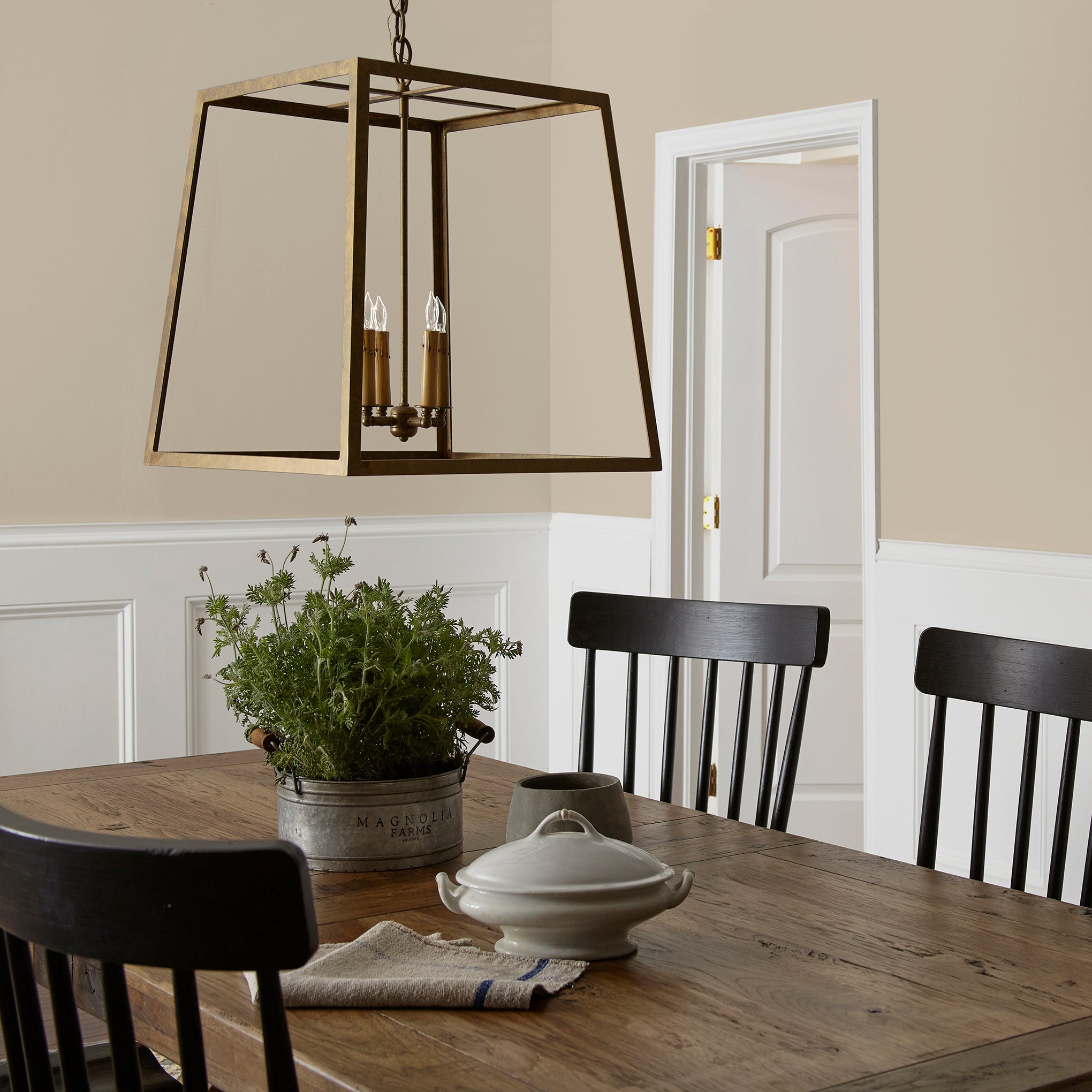 Cool beige dusted with hazel and cocoa interior paint named tapestry thread shown painted on dining room wall