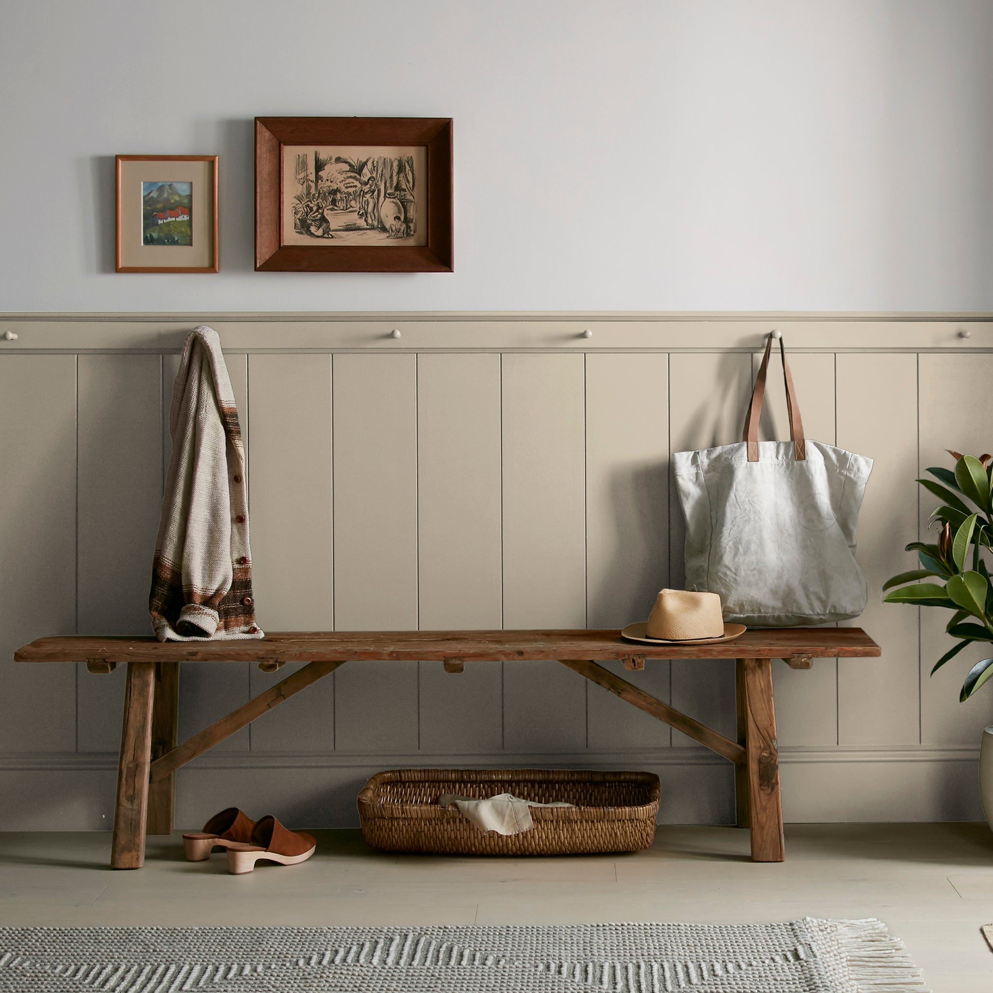 A khaki green interior paint named gold moss shown painted on entryway wall