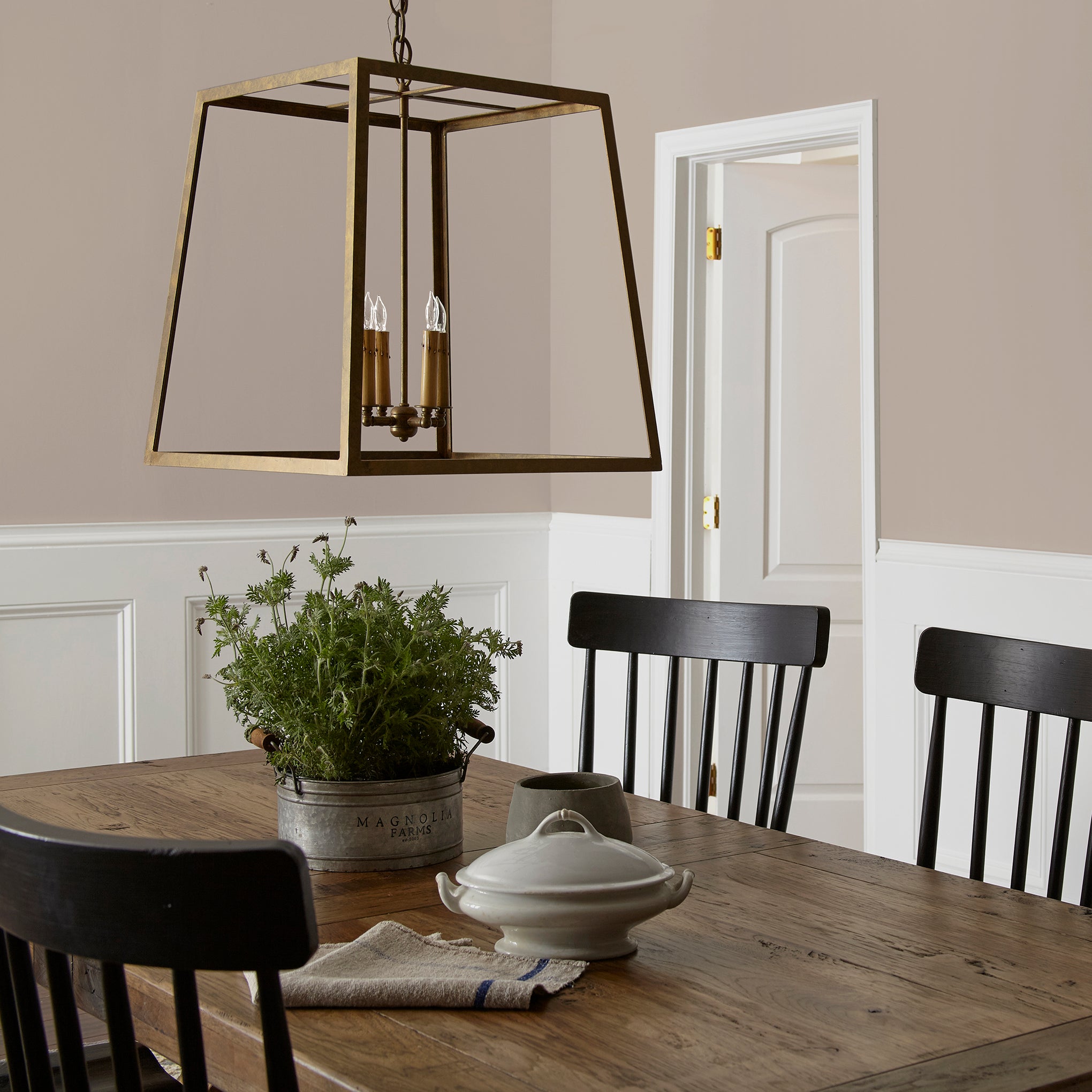 Khaki tan interior paint named rustic oak shown painted on dining room wall