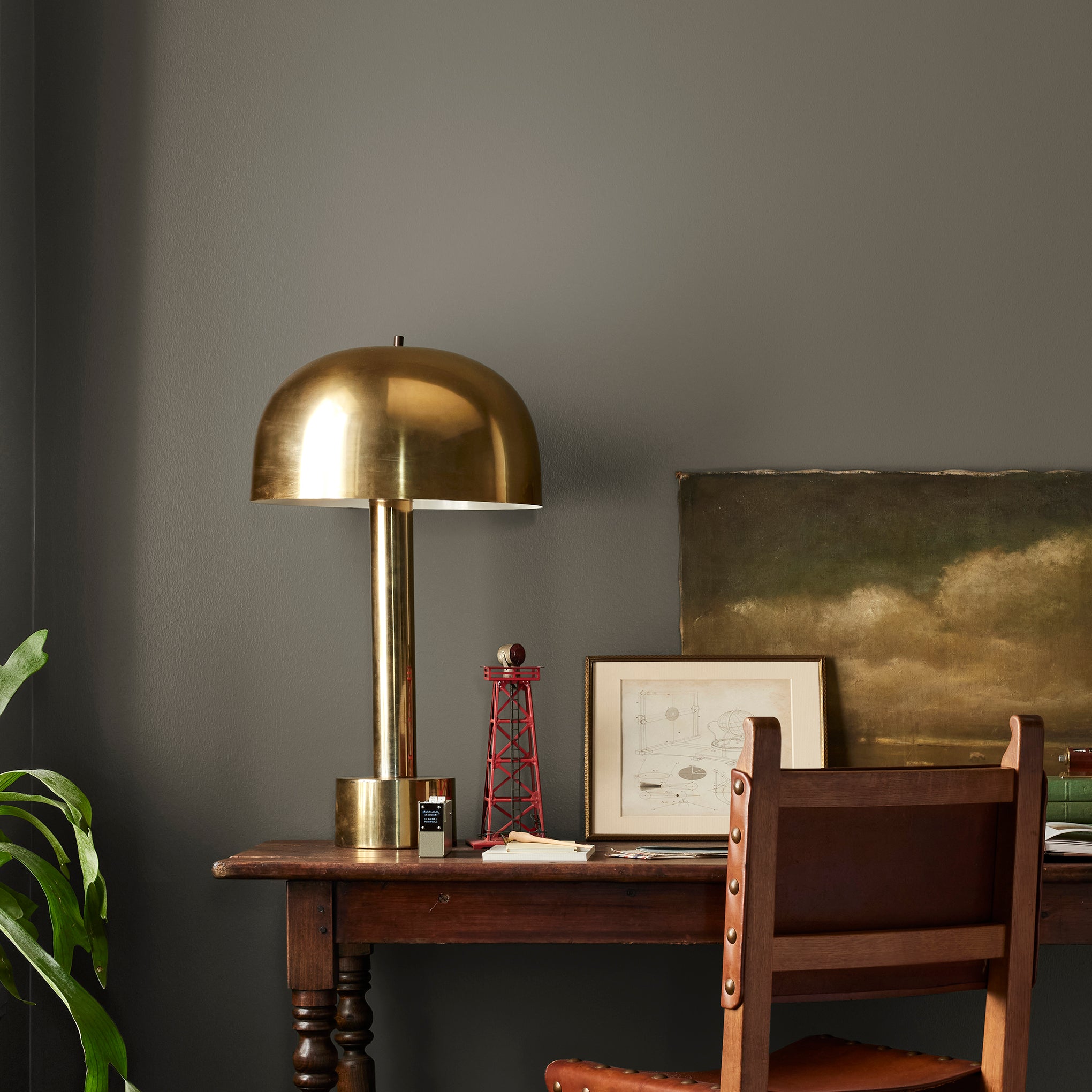 Woodsy brown with a touch of green interior paint named wooded acres shown painted on bedroom wall