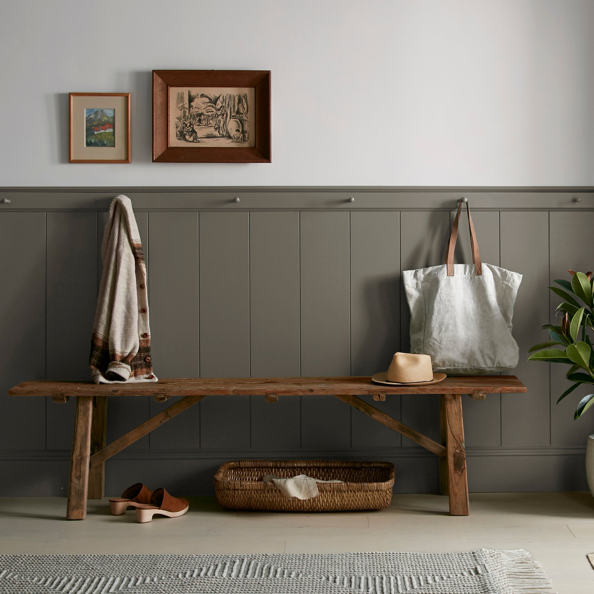 Woodsy brown with a touch of green interior paint named wooded acres shown painted on entryway wall
