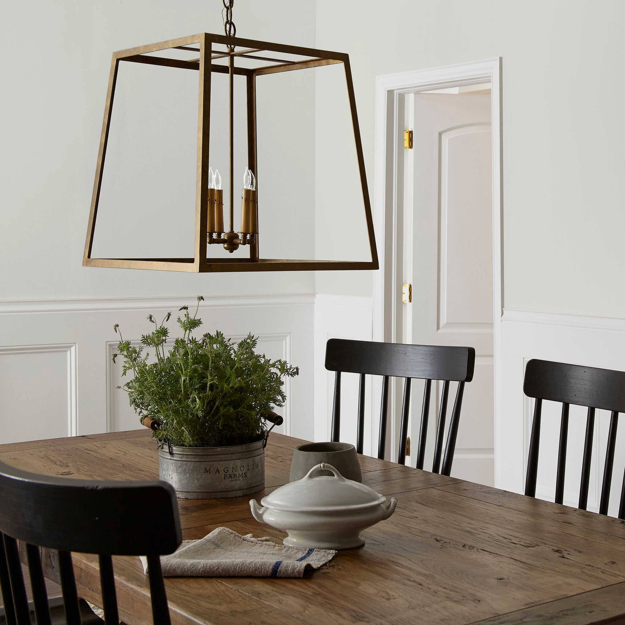 Almost white with gray and green undertones interior paint named chime gray shown painted on dining room wall
