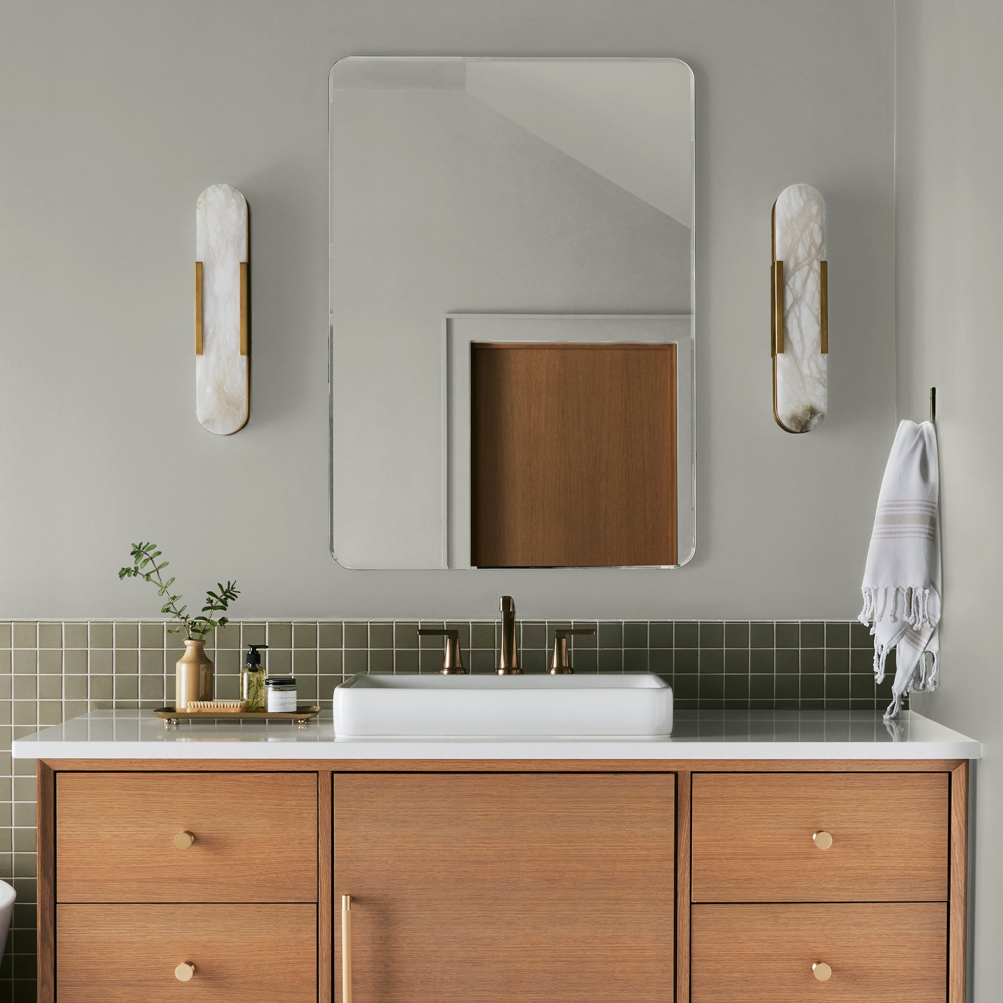 Almost white with cool mint accents interior paint named stoneware pieces shown painted on bathroom wall