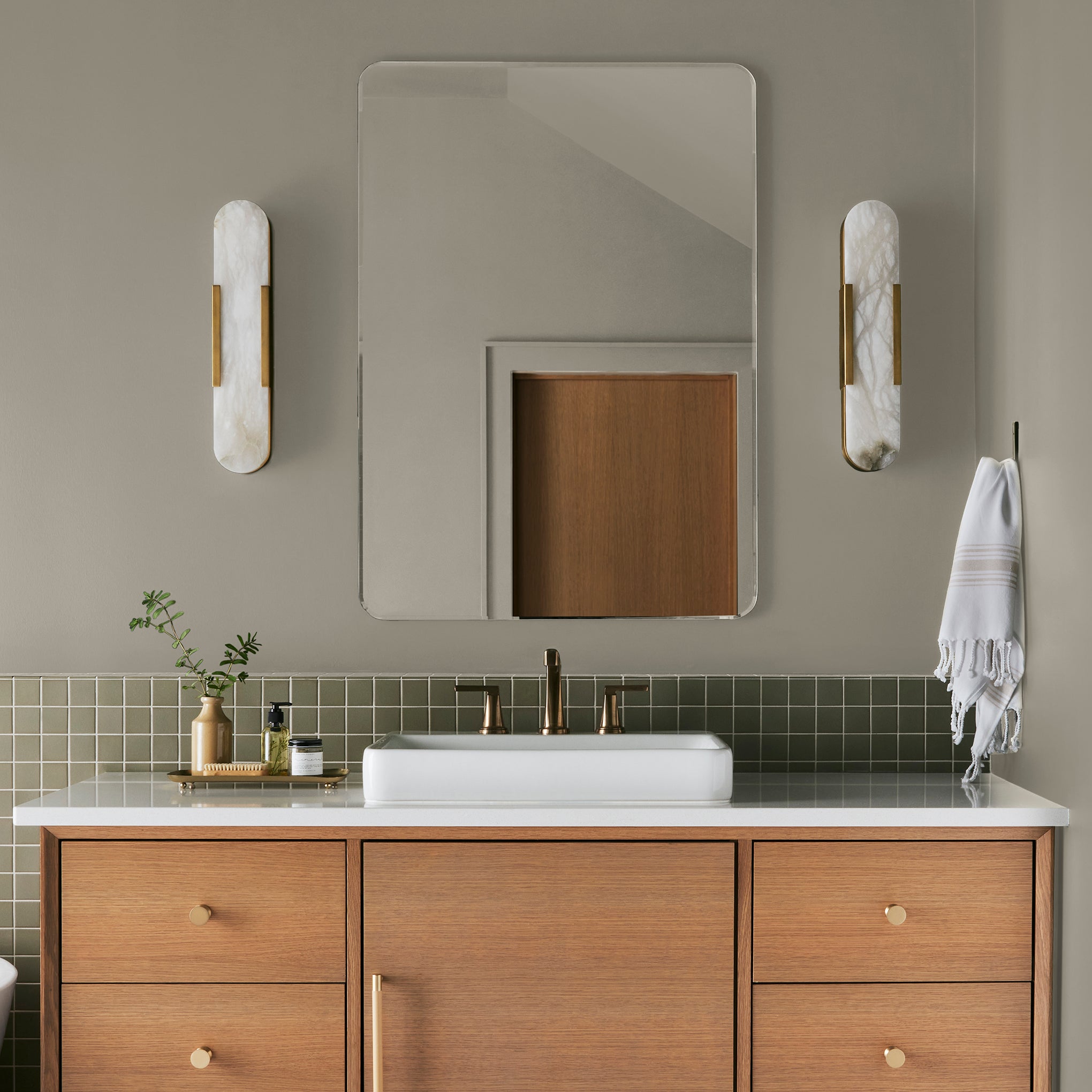 Muted apple green with gray accents interior paint named seasonal shown painted on bathroom wall