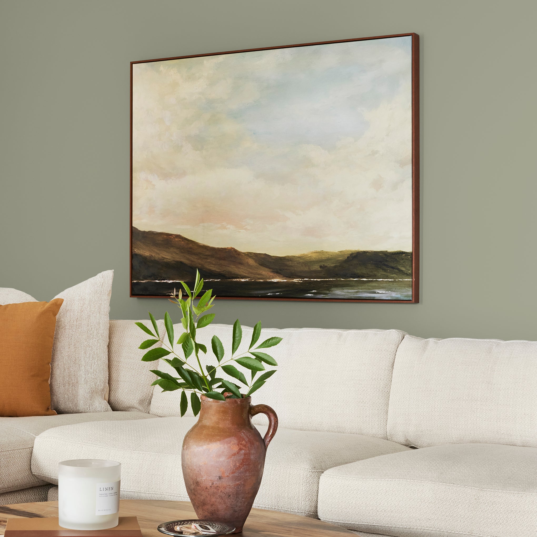 dark grey-green interior paint named garden essential shown painted on living room wall