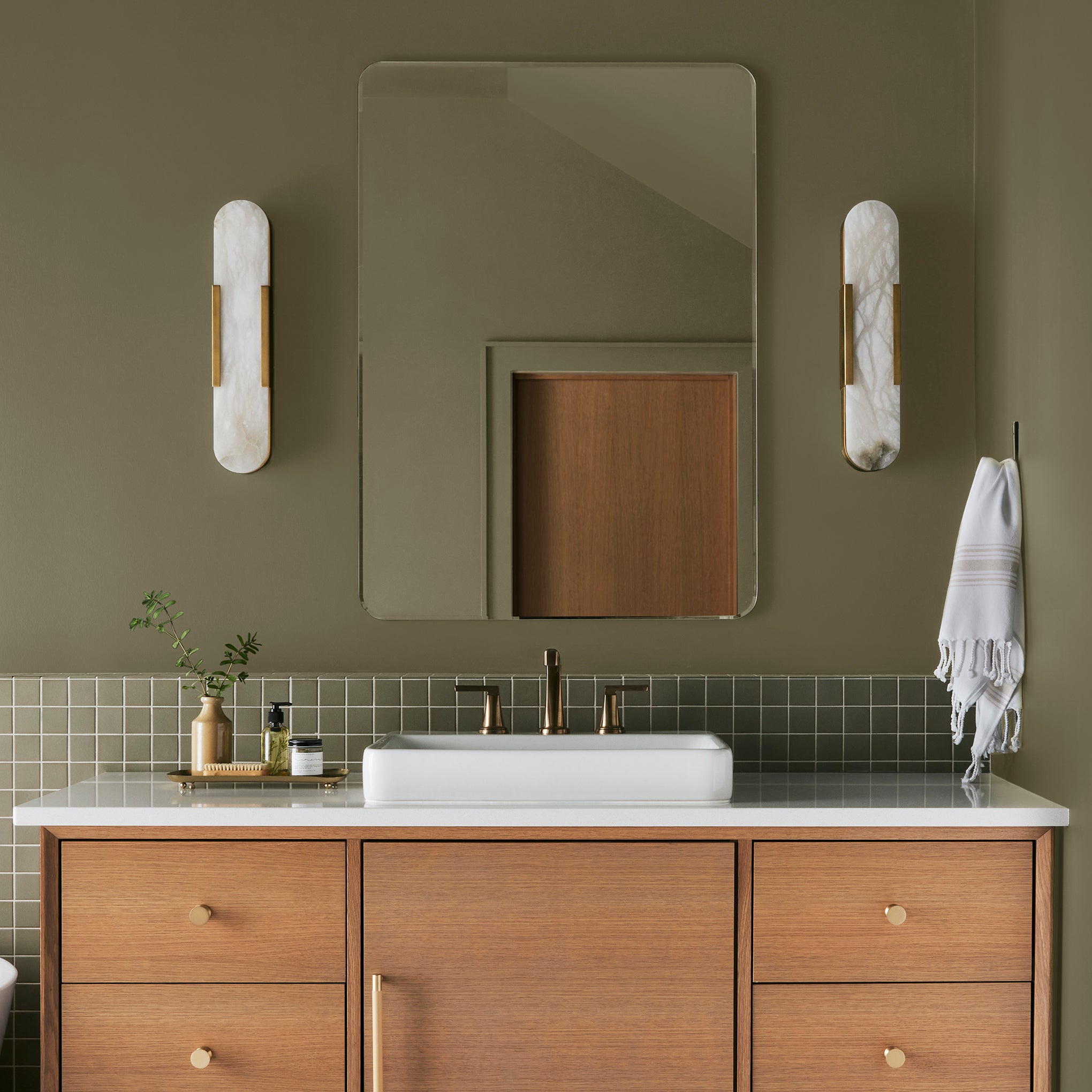 Asparagus green with hazel hues interior paint named landscape shown painted on bathroom wall