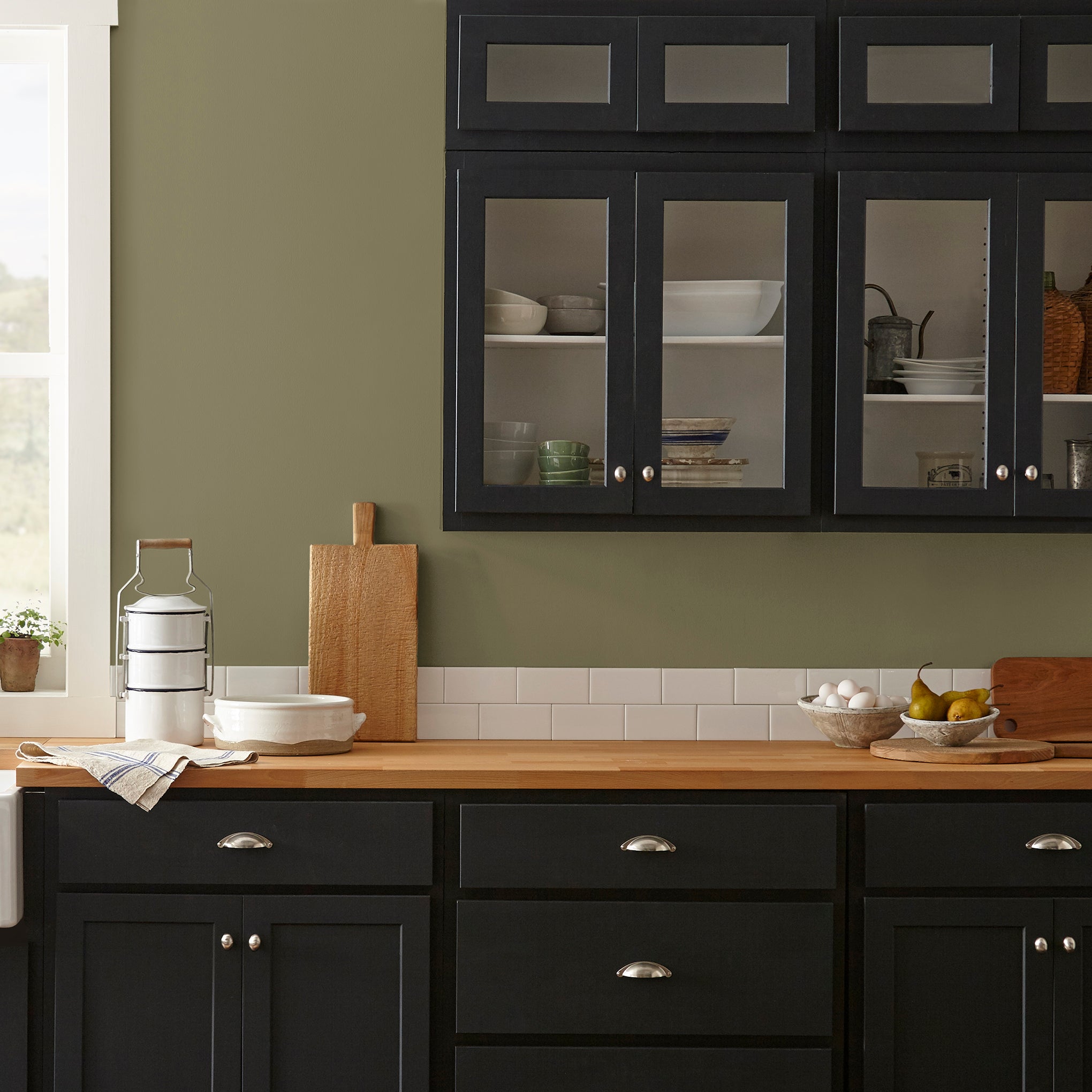 Asparagus green with hazel hues interior paint named landscape shown painted on kitchen wall