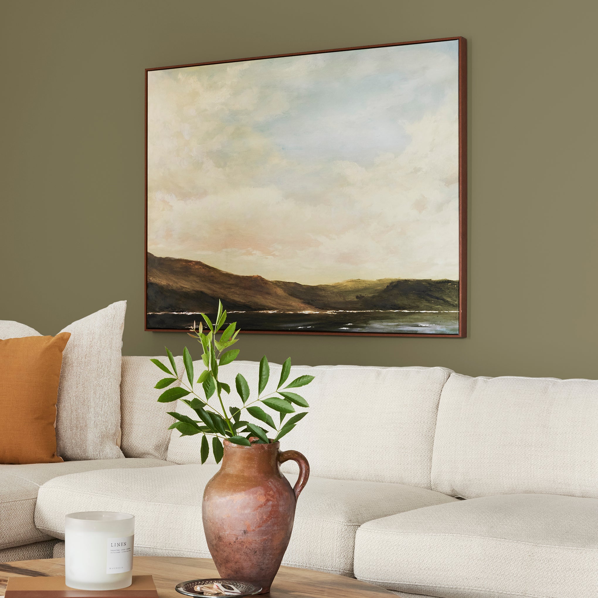 Asparagus green with hazel hues interior paint named landscape shown painted on living room wall