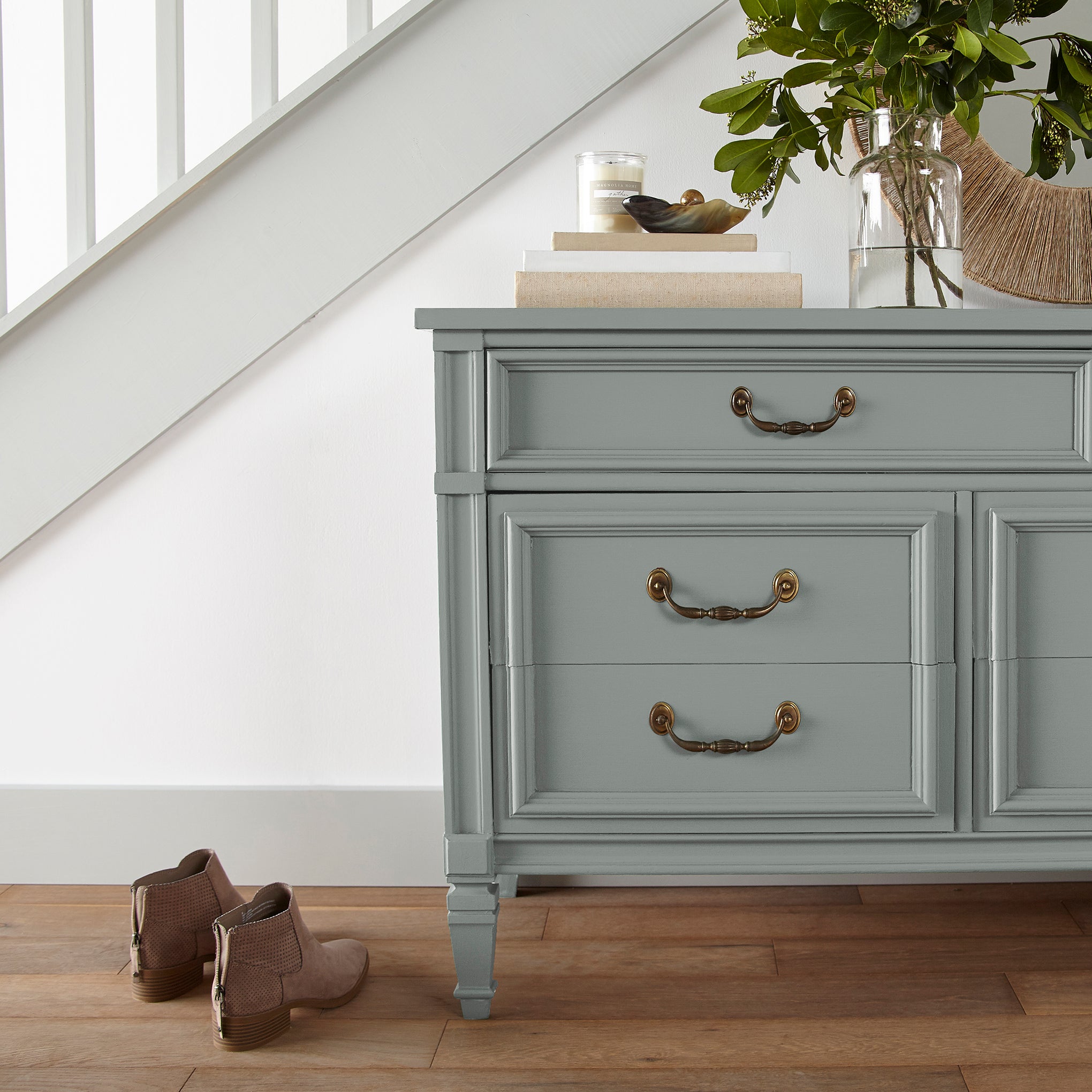 Cement gray with blue undertones door and cabinet paint named clean slate shown painted on entryway cabinet