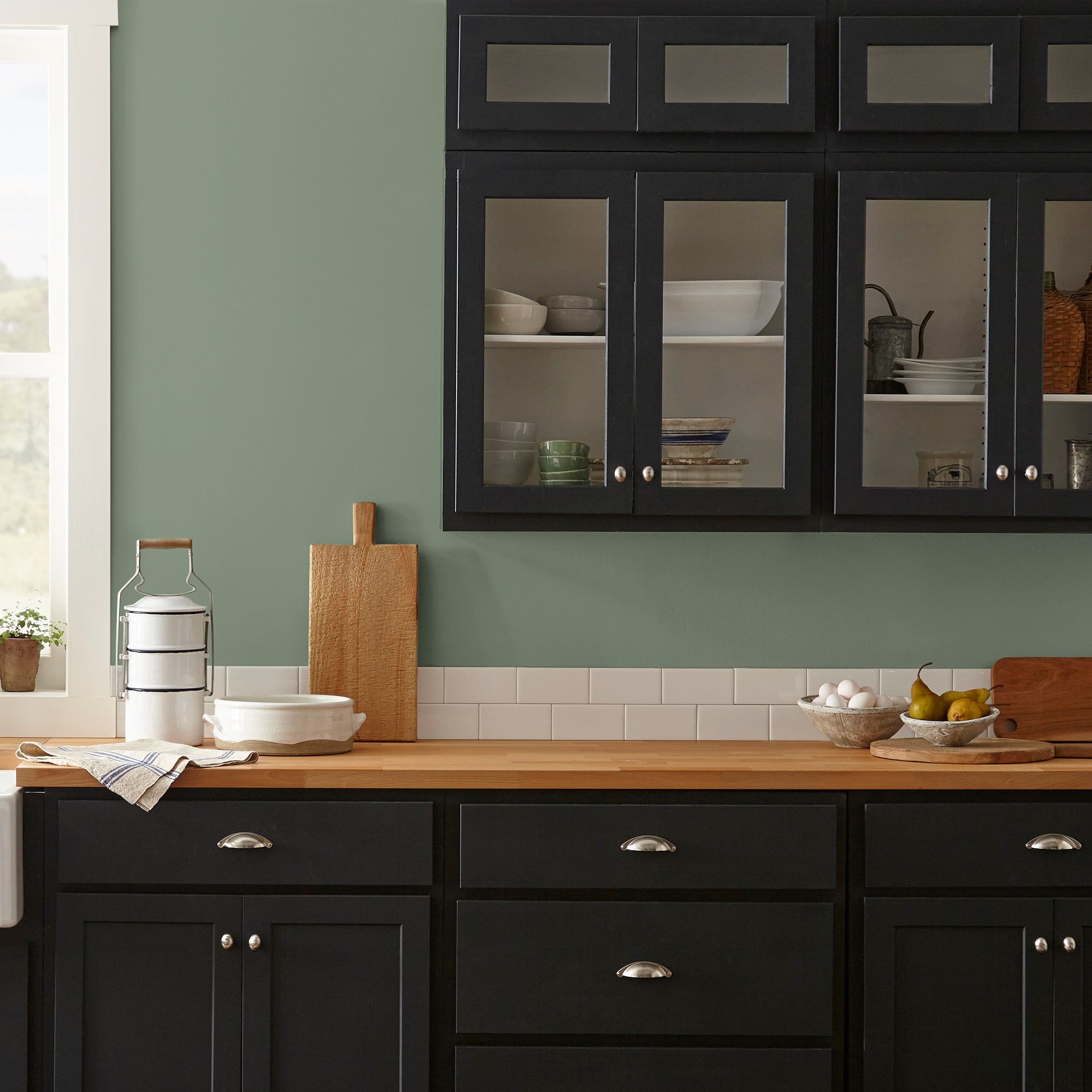 medium olive green paint named olive grove shown painted on kitchen wall