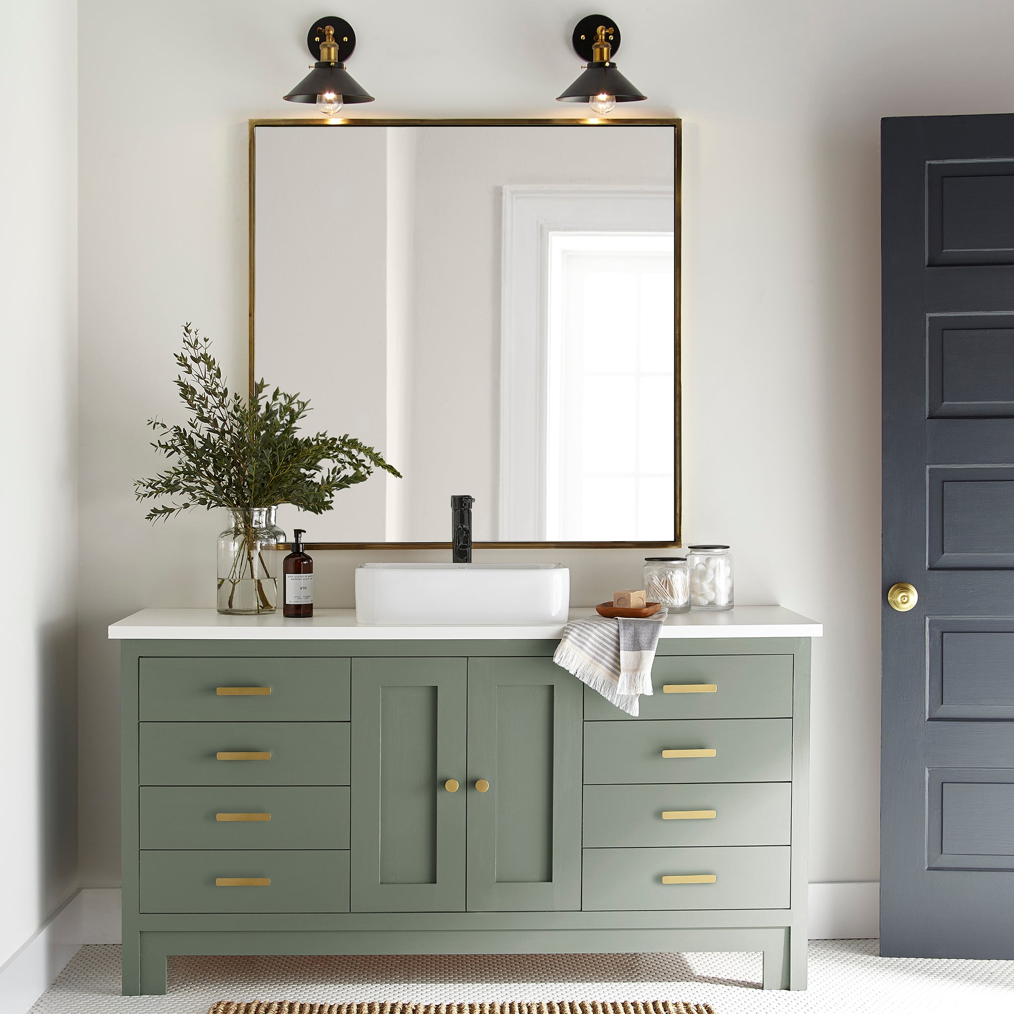 Earthy green with natural hints of hazel door and cabinet paint named olive grove shown painted on bathroom cabinet