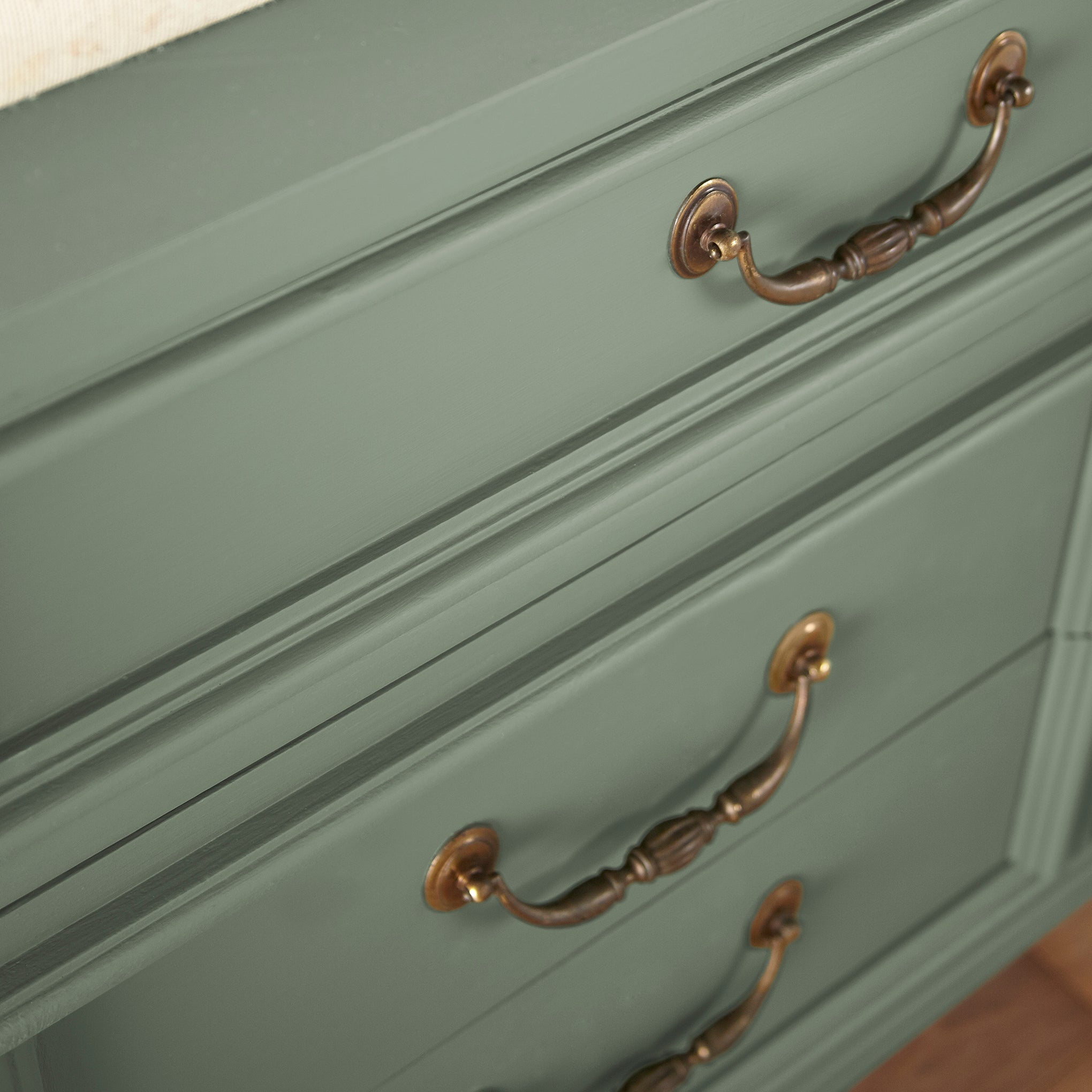 Earthy green with natural hints of hazel door and cabinet paint named olive grove shown painted on cabinet