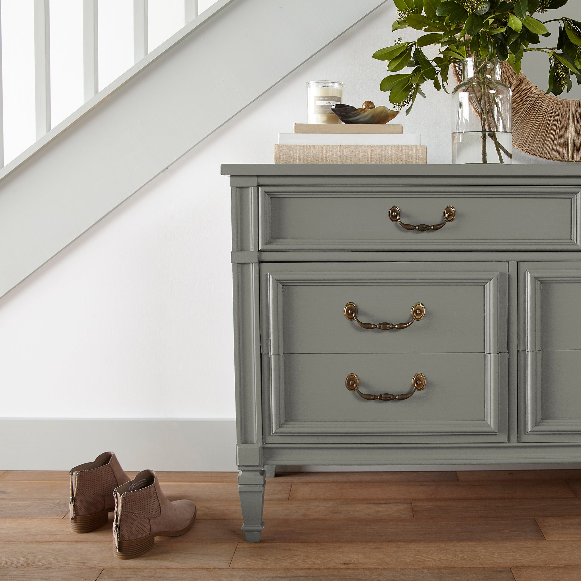 Gray with sage and olive green undertones door and cabinet paint named boutique gray shown painted on entryway cabinet