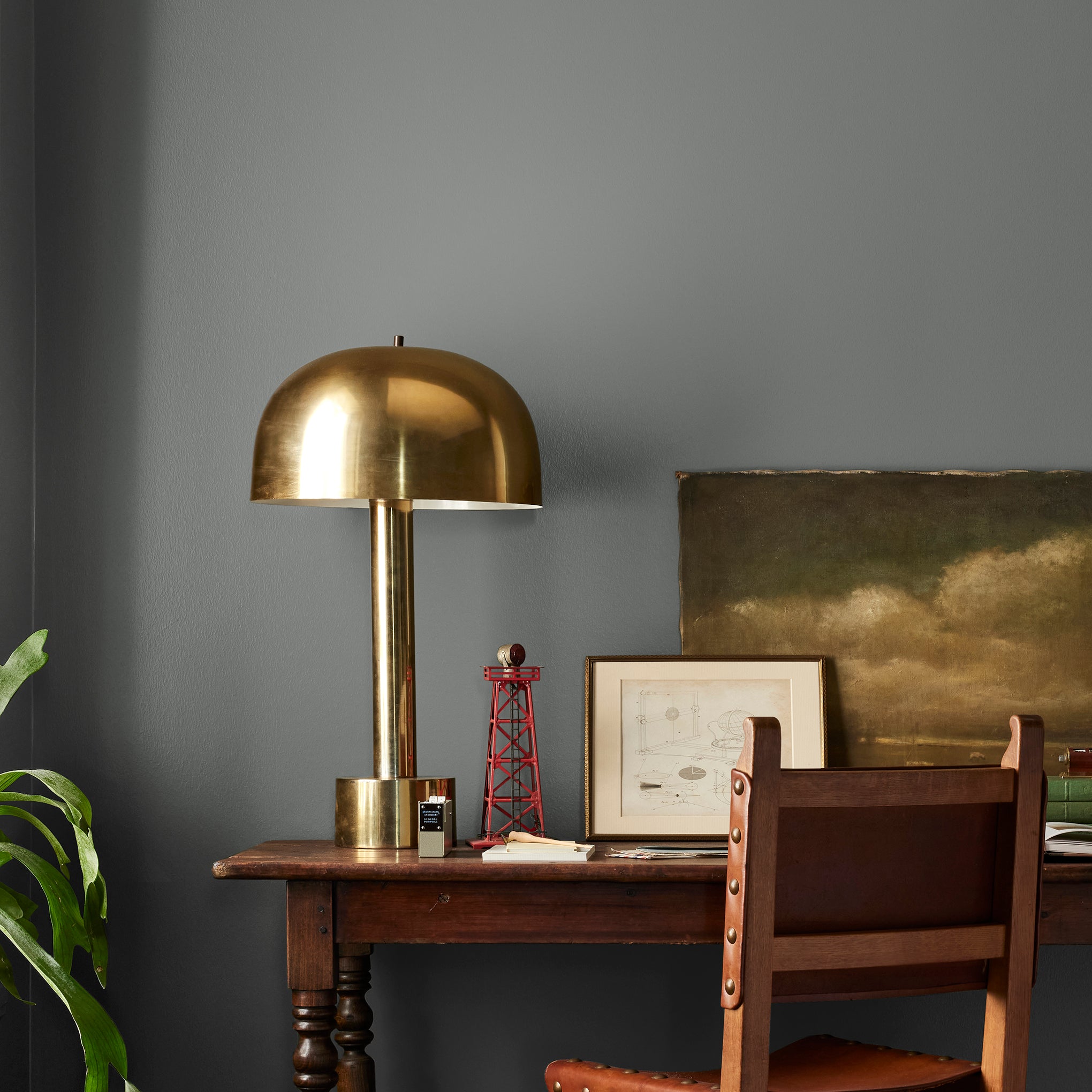 Deep haze gray with brown and silver notes interior paint named pond stone shown painted on bedroom wall