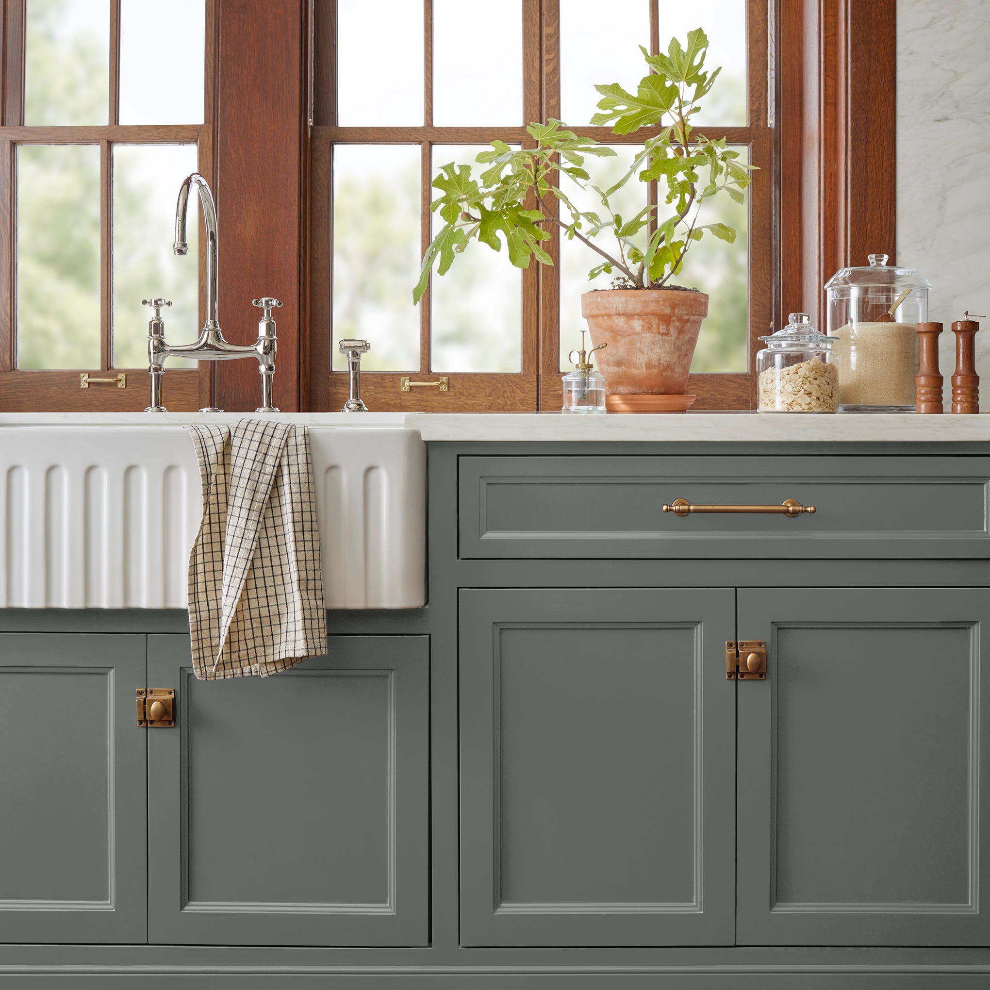 Deep haze gray with silver notes door and cabinet paint named pond stone shown painted on kitchen cabinet  