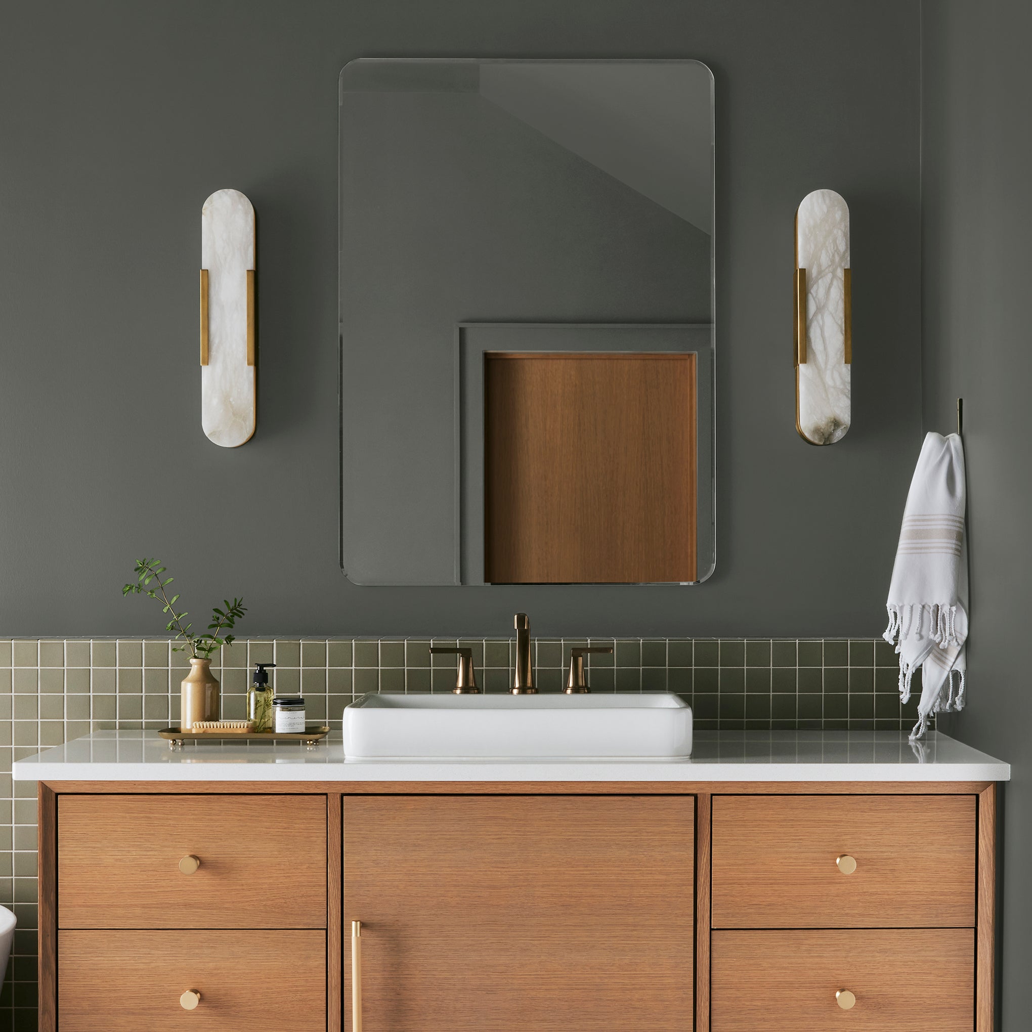 Dark hunter green interior paint named Locally Grown shown painted on bathroom wall