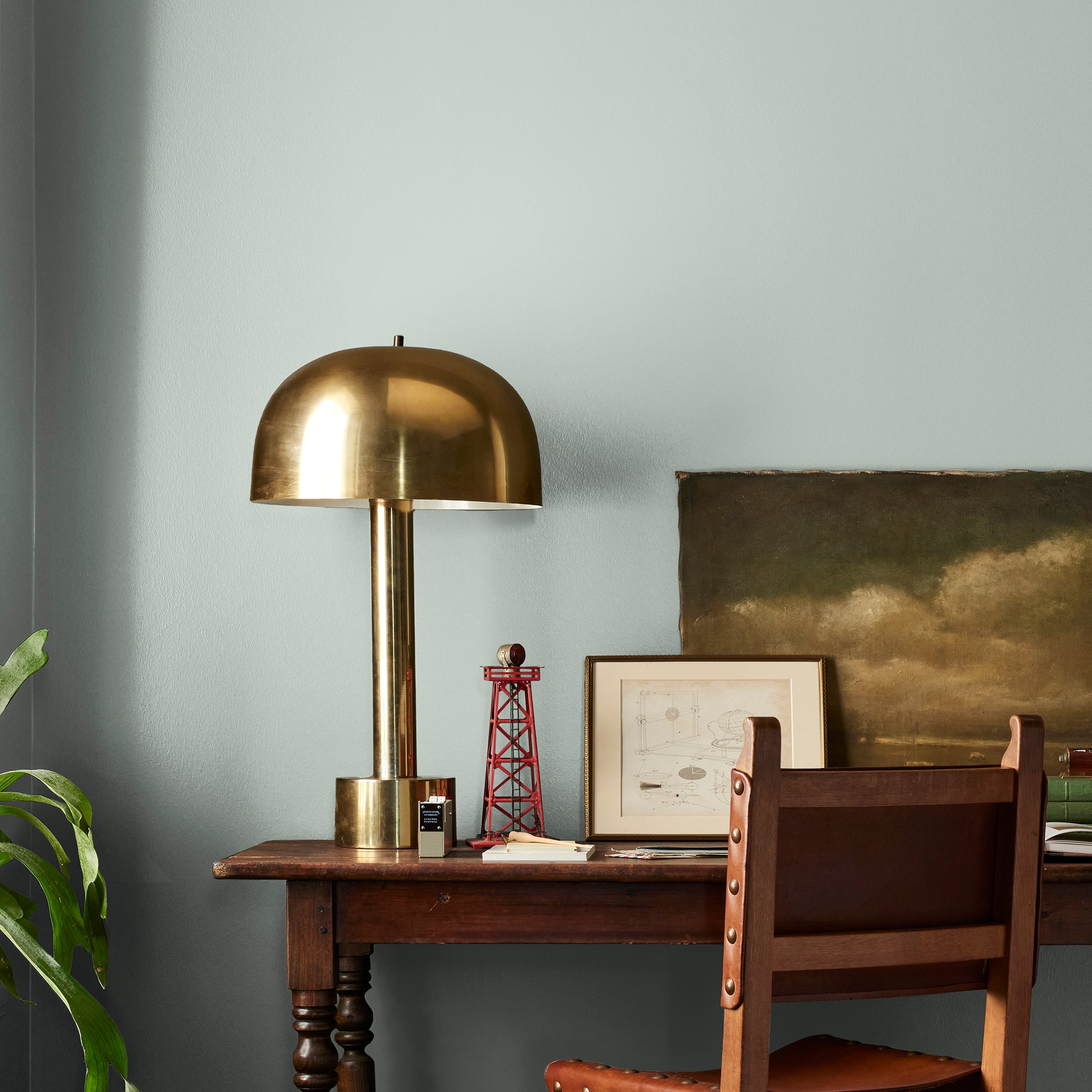 Frosty mint green with light blue undertone interior paint named mineral green shown painted on bedroom wall
