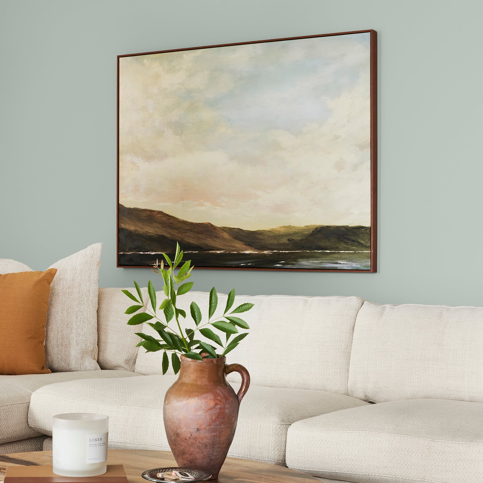 Frosty mint green with light blue undertone interior paint named mineral green shown painted on living room wall
