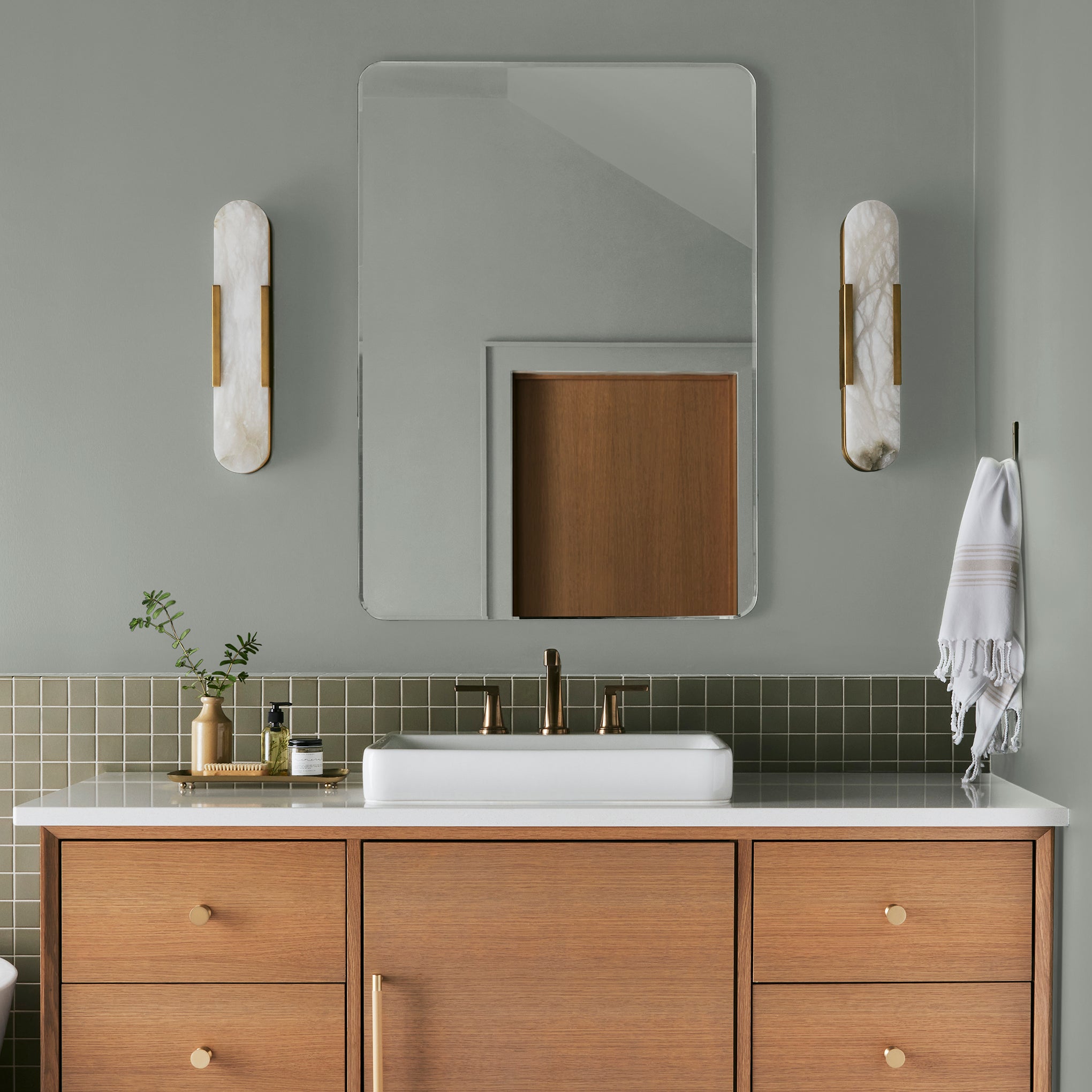 Frosty mint green with beige notes interior paint named early riser shown painted on bathroom wall