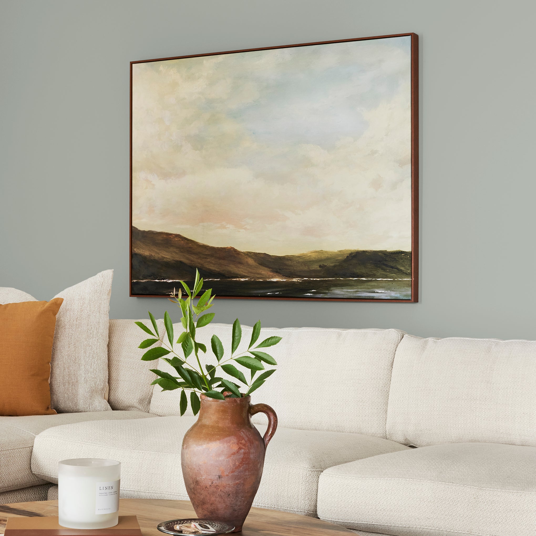 Frosty mint green with beige notes interior paint named early riser shown painted on living room wall
