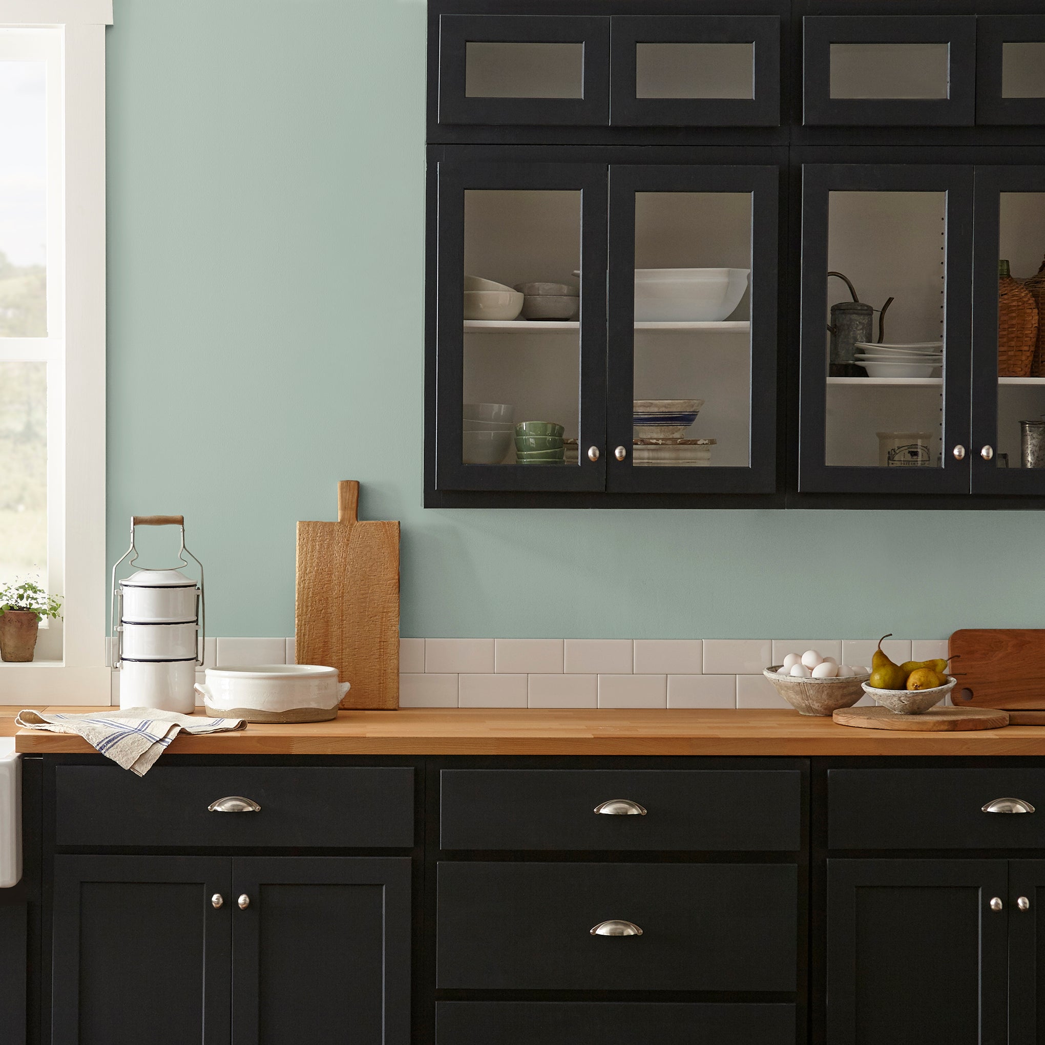 Creamy mint green interior paint named freshly cut stems shown painted on kitchen wall