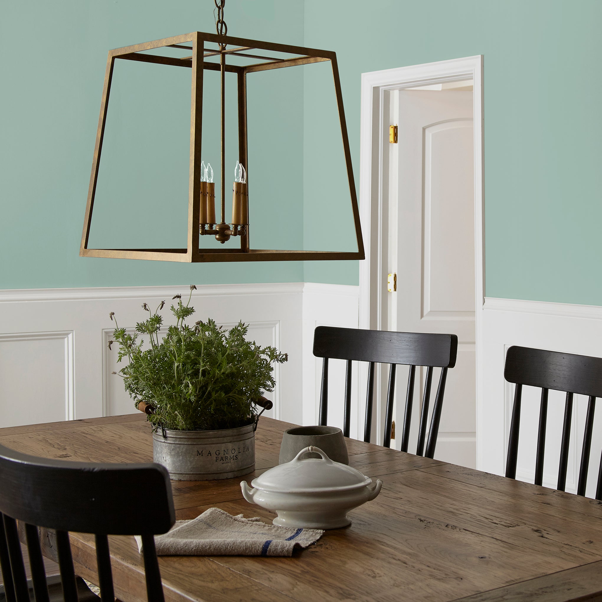 Aqua and minty blue slightly muted with gray interior paint named texas summer shown painted on dining room wall